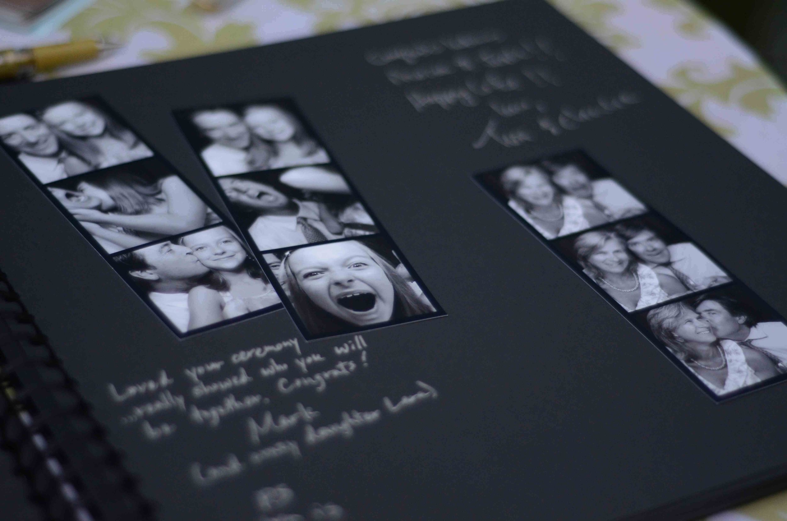 A black photo album page with multiple black and white photo booth style pictures of a woman, a man, and a young girl making different expressions. Handwritten notes and captions are visible at the bottom and top of the page.