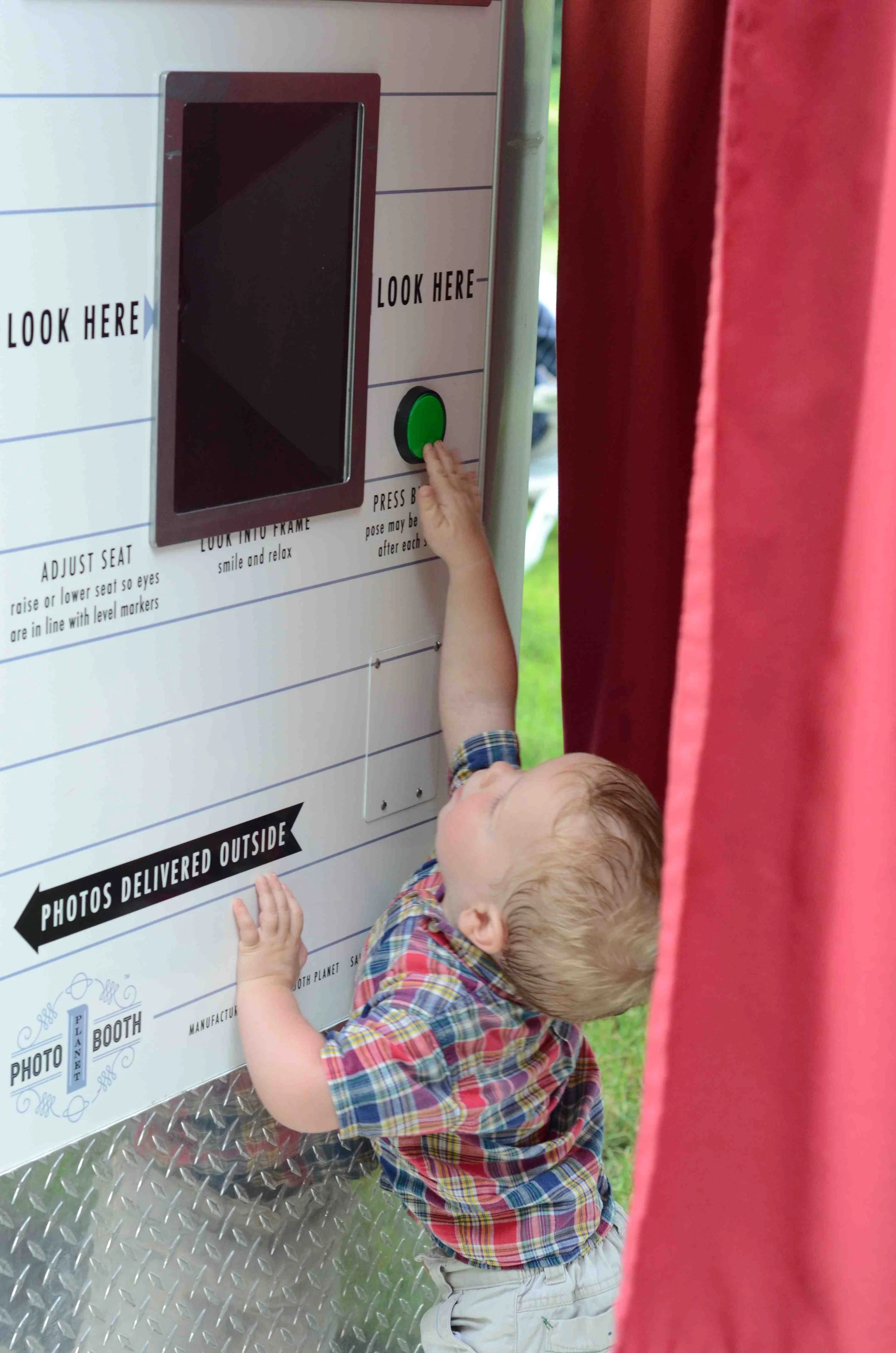 connecticut everyone loves a photo booth especially kids! vintage photo booth toddler pushing button