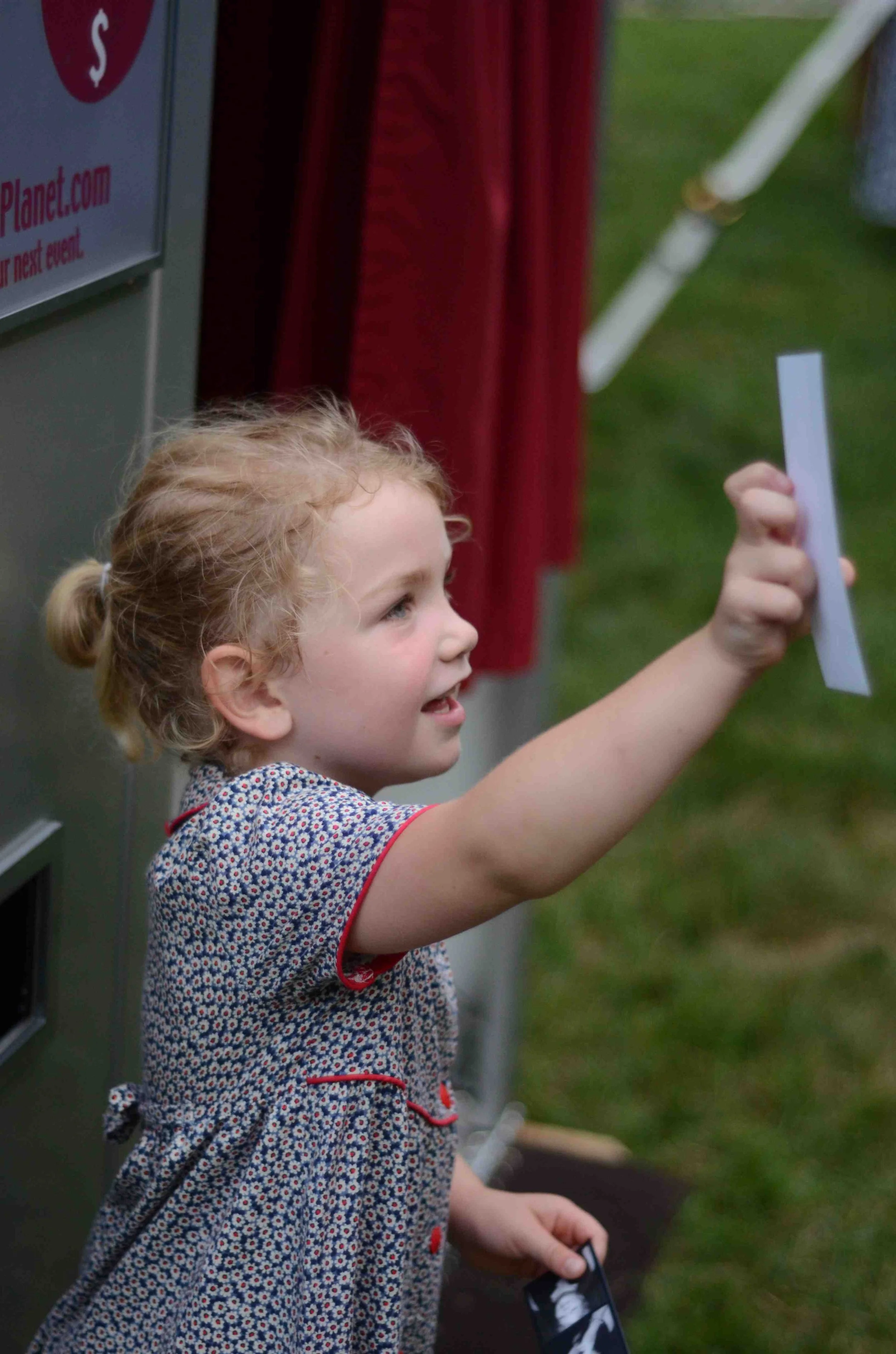connecticut everyone loves a photo booth especially kids! little girl holding photo strip