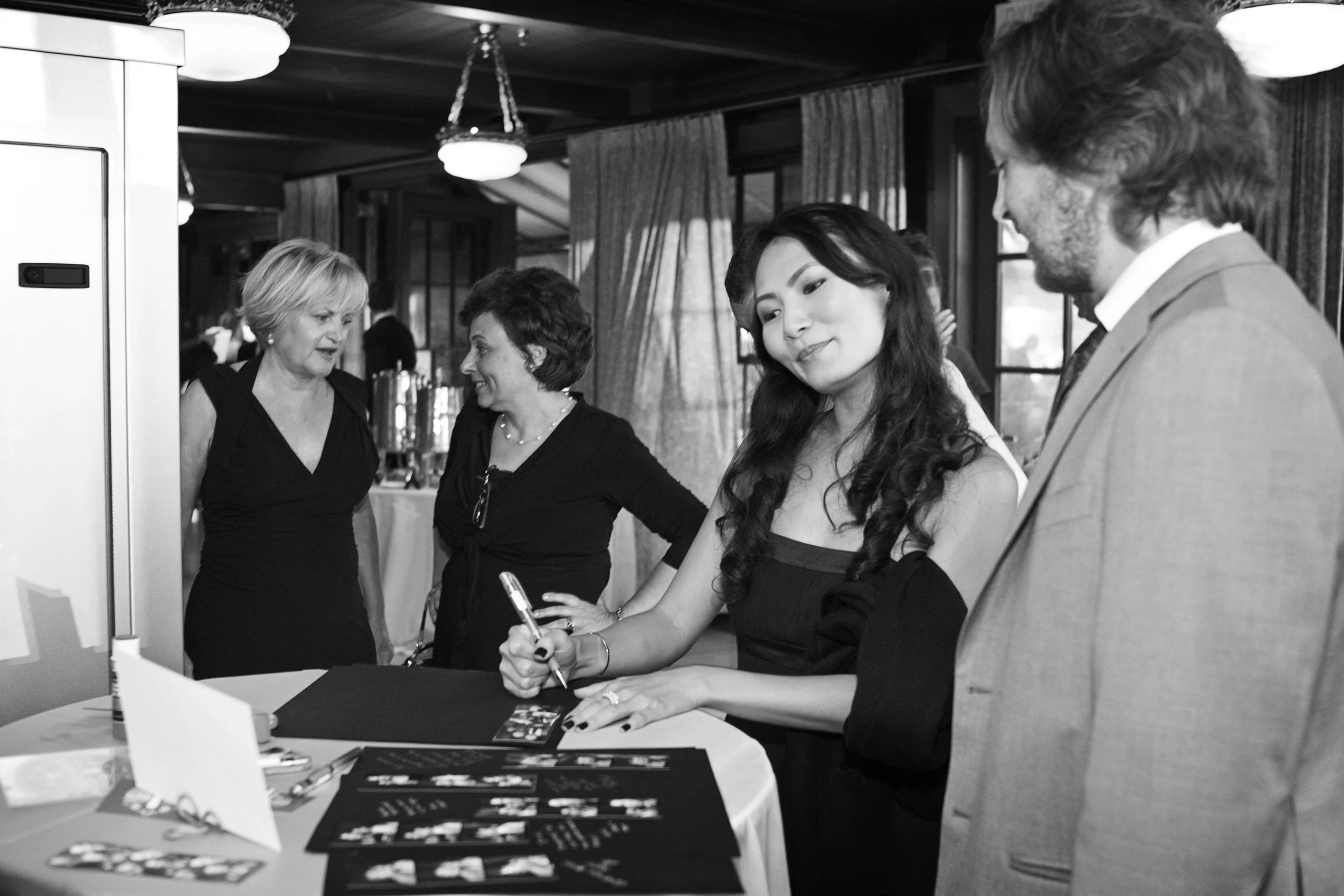 connecticut compiling the scrapbook! guests with photo book