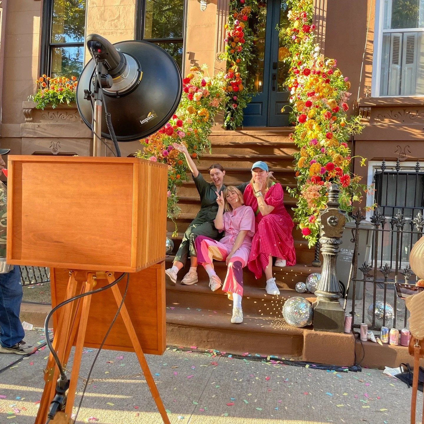 Photo Booth magic on the stoop! Our open-air bellows booth captured all the joy at the @brownstoneboys unforgettable wedding 💐 Planned /Designed by @modernrebel and featured in the @nytimes, this day was filled with flowers, confetti, and the true s