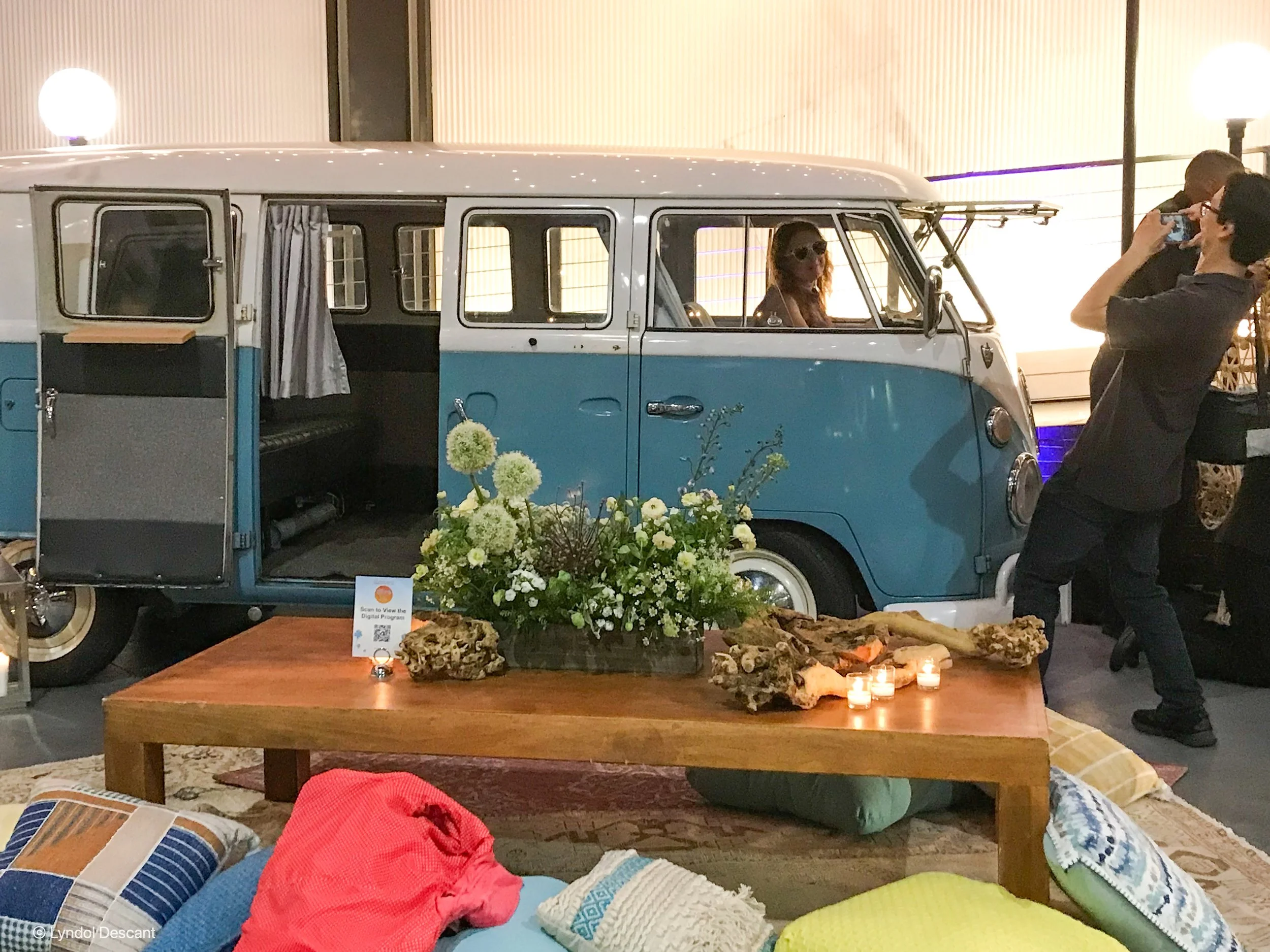vintage VW van photo booth rental with outdoor setup and props table