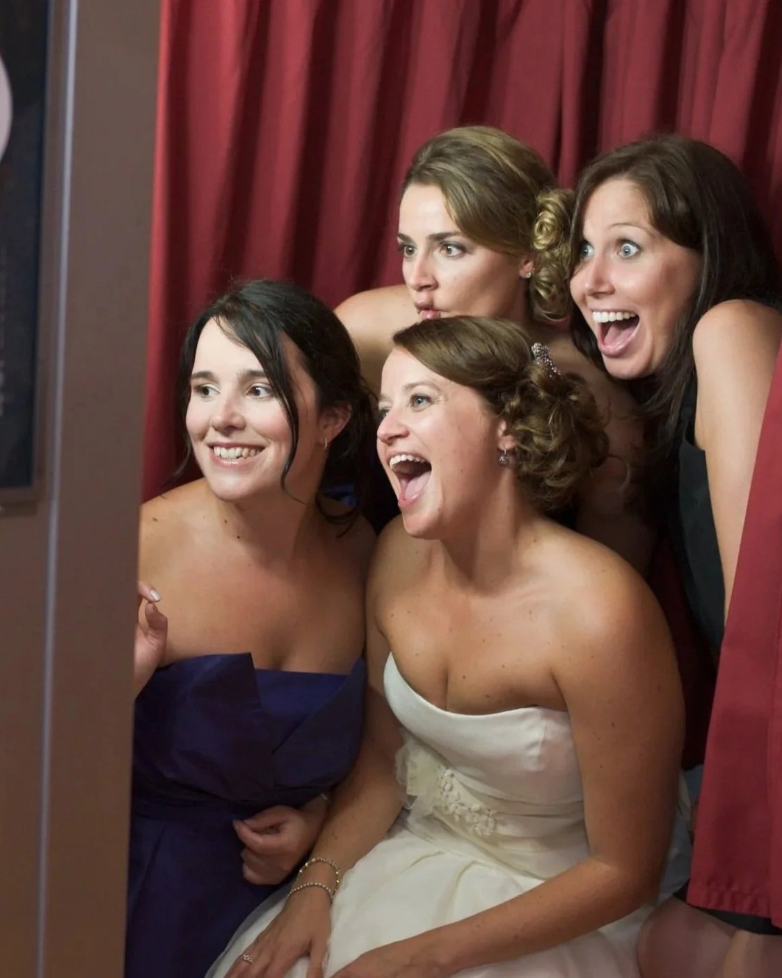 women at wedding dress fitting showing reactions of happiness and surprise