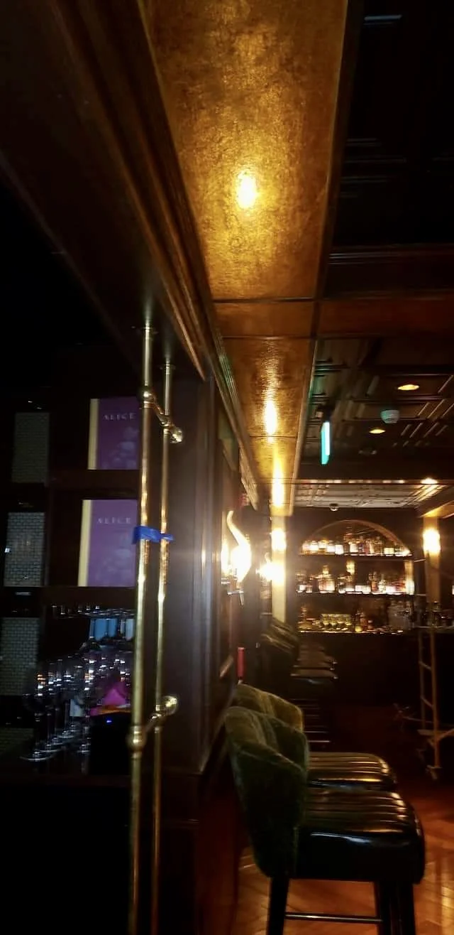 Wicked Rabbit and Alice Lounges commercial installation by Custom Artisan Finishes in Omaha, Nebraska. Commercial Restoration and Installation, gold leafing, gilding, masonry repair, by Custom Artisan Finishes in Omaha, Nebraska.