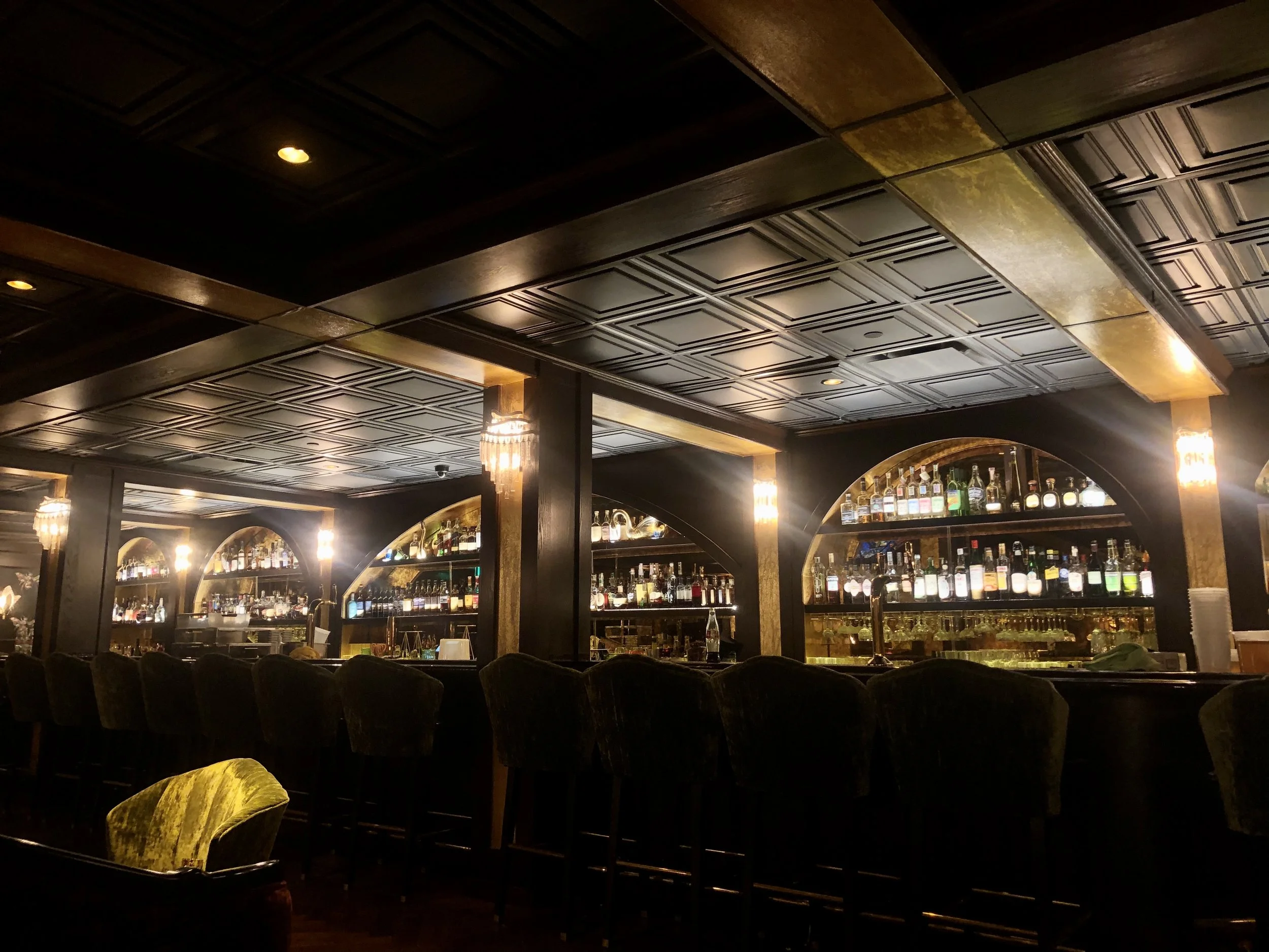 Wicked Rabbit and Alice Lounges commercial installation by Custom Artisan Finishes in Omaha, Nebraska. Commercial Restoration and Installation, gold leafing, gilding, masonry repair, by Custom Artisan Finishes in Omaha, Nebraska.