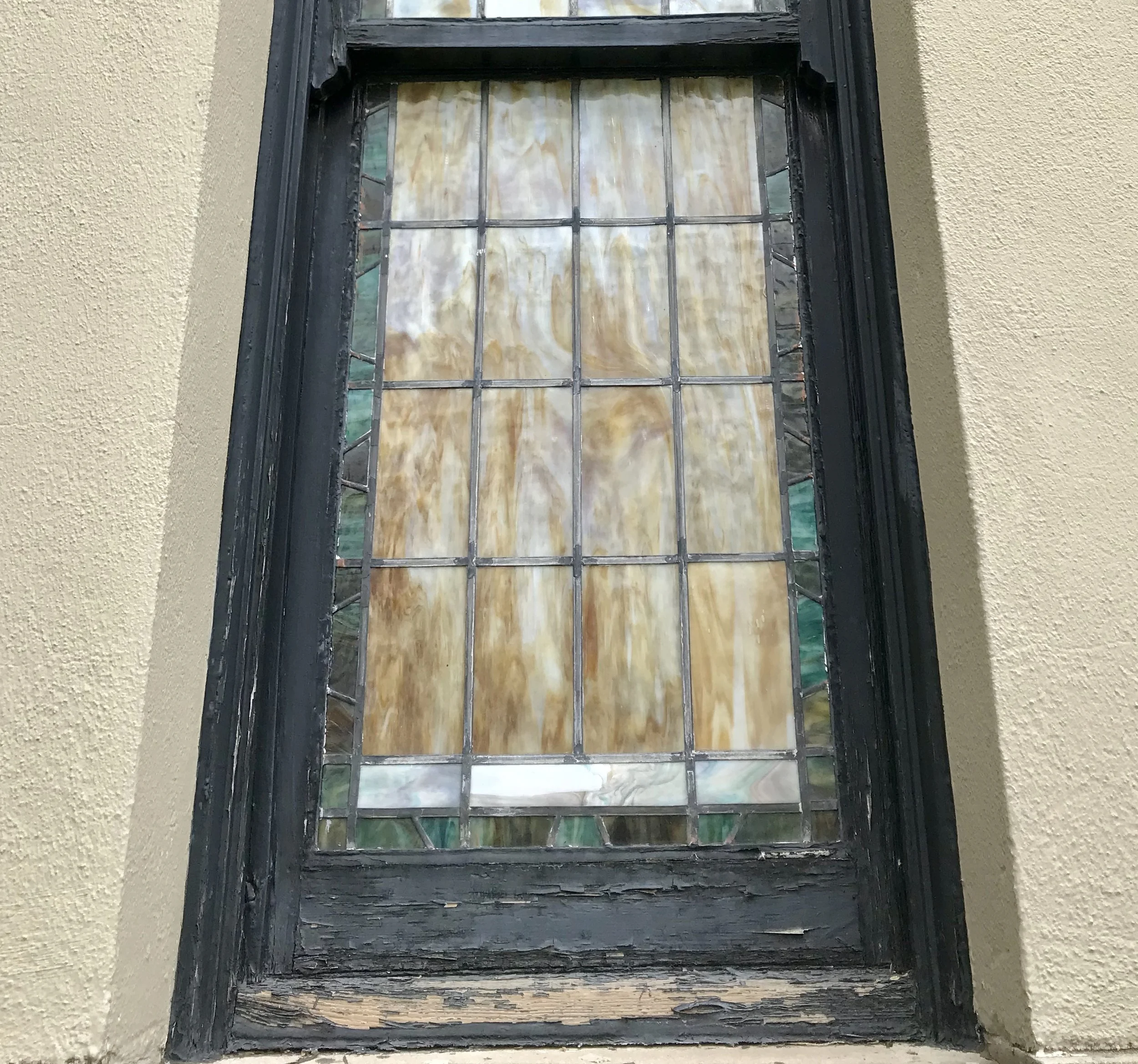 St. Francis stained glass window repair. Historical restoration by Custom Artisan Finishes in Omaha, Nebraska.