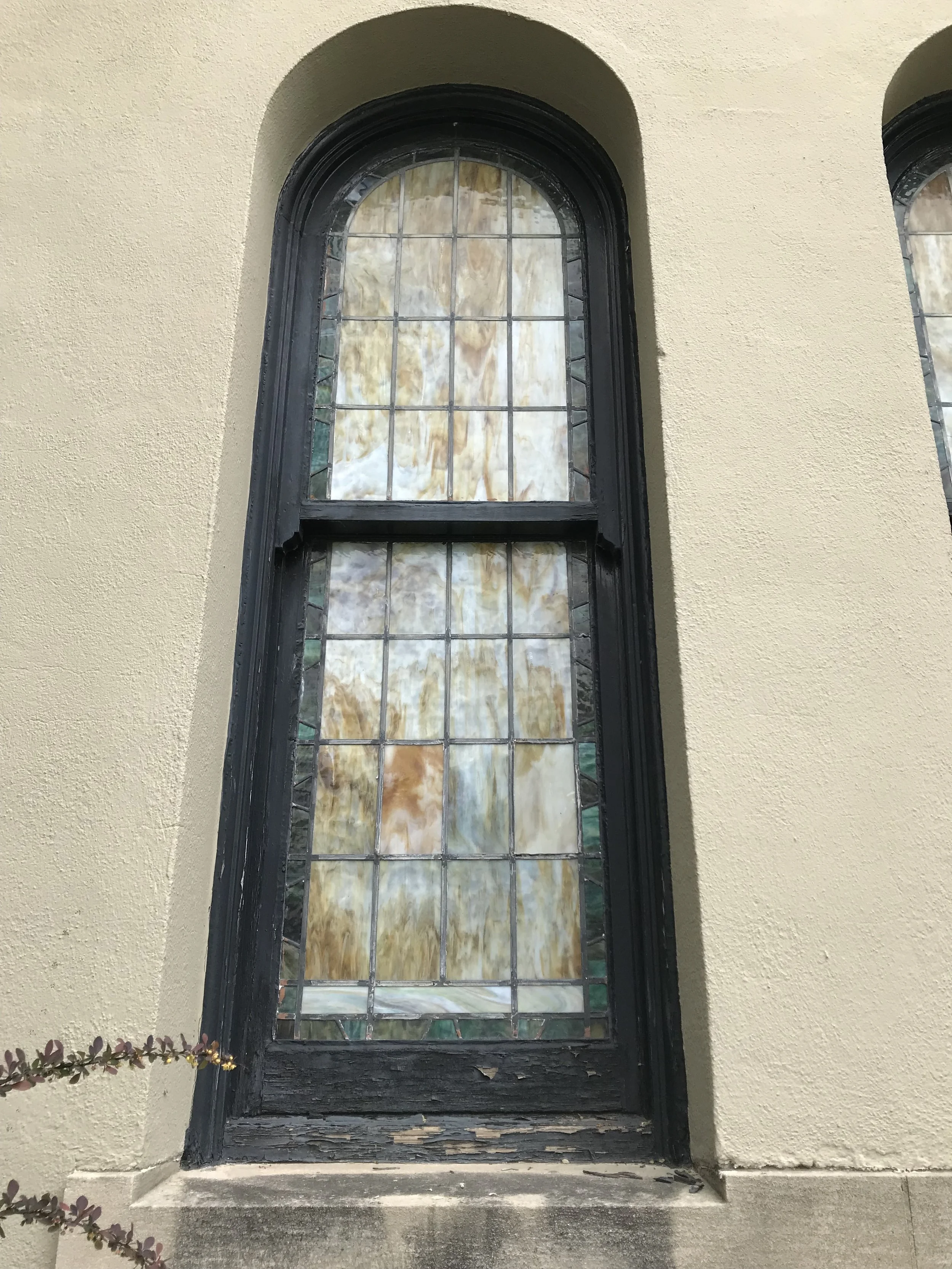 St. Francis stained glass window repair. Historical restoration by Custom Artisan Finishes in Omaha, Nebraska.