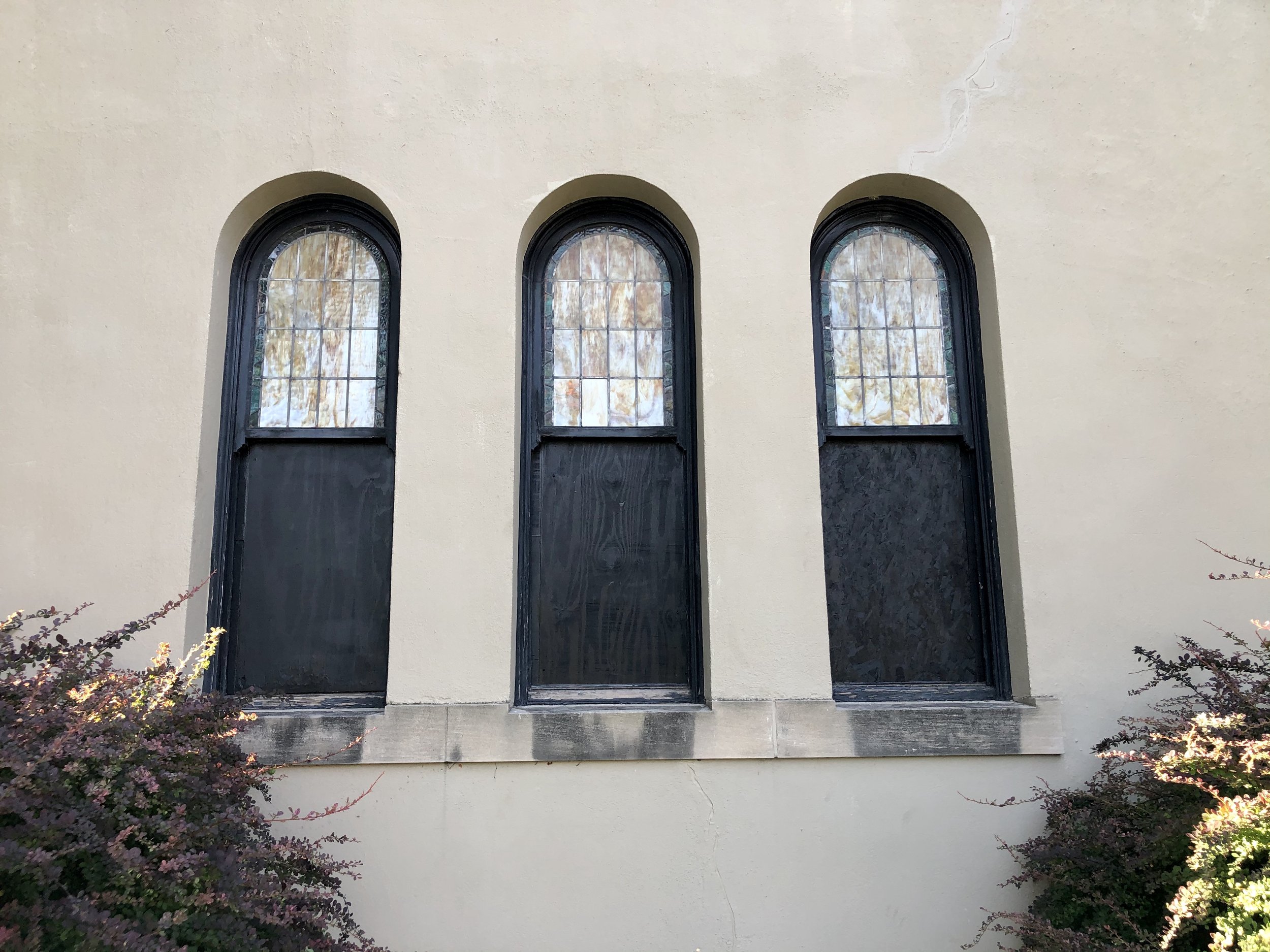 St. Francis stained glass window repair. Historical restoration by Custom Artisan Finishes in Omaha, Nebraska.