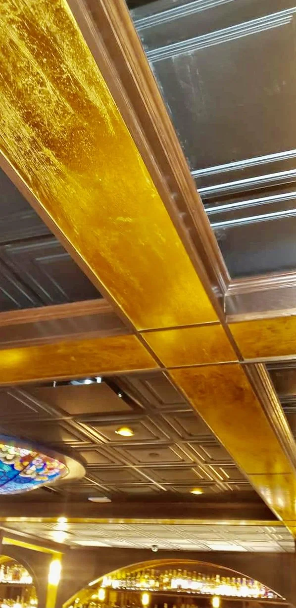 Wicked Rabbit and Alice Lounges commercial installation by Custom Artisan Finishes in Omaha, Nebraska. Commercial Restoration and Installation, gold leafing, gilding, masonry repair, by Custom Artisan Finishes in Omaha, Nebraska.