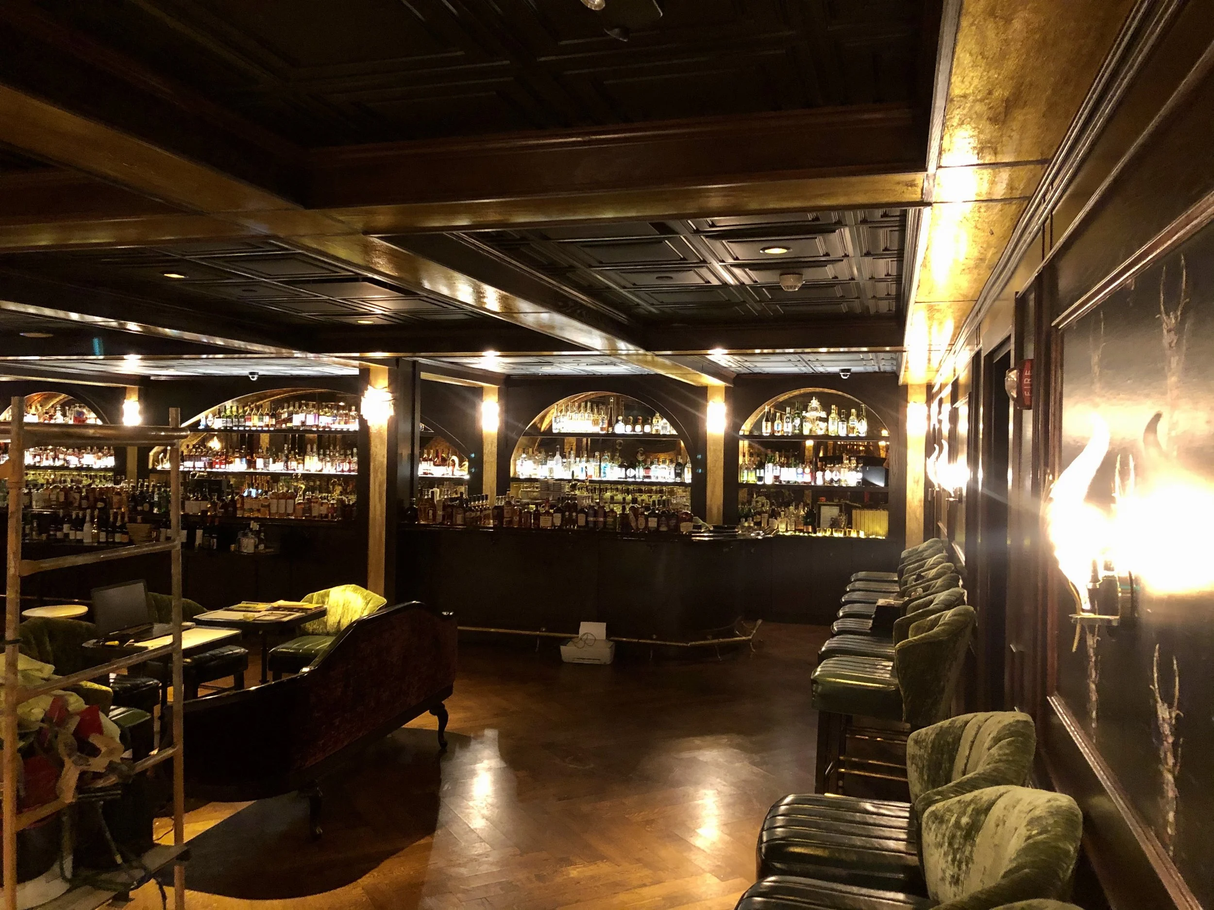Wicked Rabbit and Alice Lounges commercial installation by Custom Artisan Finishes in Omaha, Nebraska. Commercial Restoration and Installation, gold leafing, gilding, masonry repair, by Custom Artisan Finishes in Omaha, Nebraska.