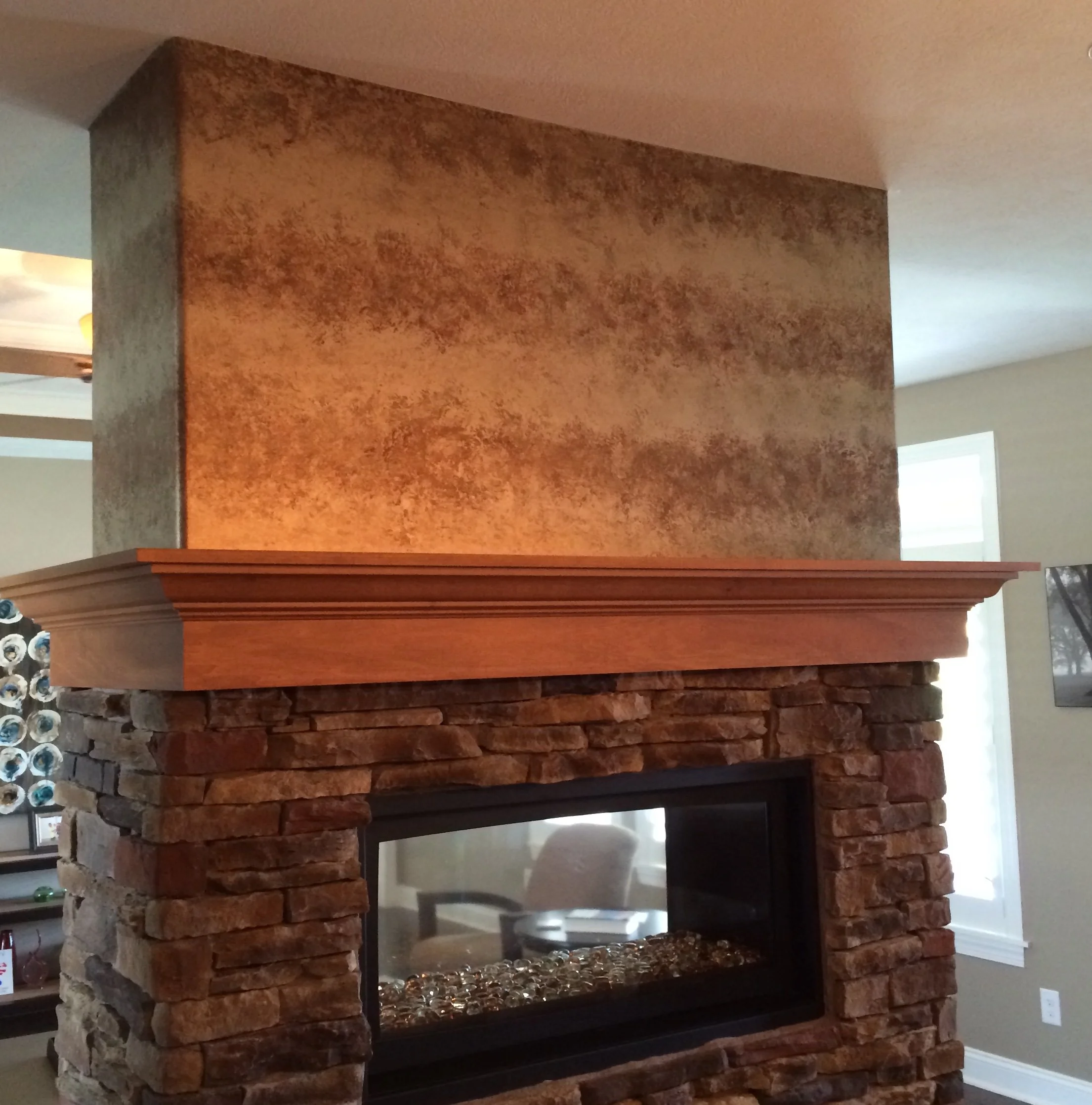 Residential fireplace finish by Custom Artisan Finishes in Omaha, Nebraska 