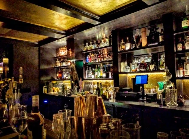 Wicked Rabbit and Alice Lounges commercial installation by Custom Artisan Finishes in Omaha, Nebraska. Commercial Restoration and Installation, gold leafing, gilding, masonry repair, by Custom Artisan Finishes in Omaha, Nebraska.