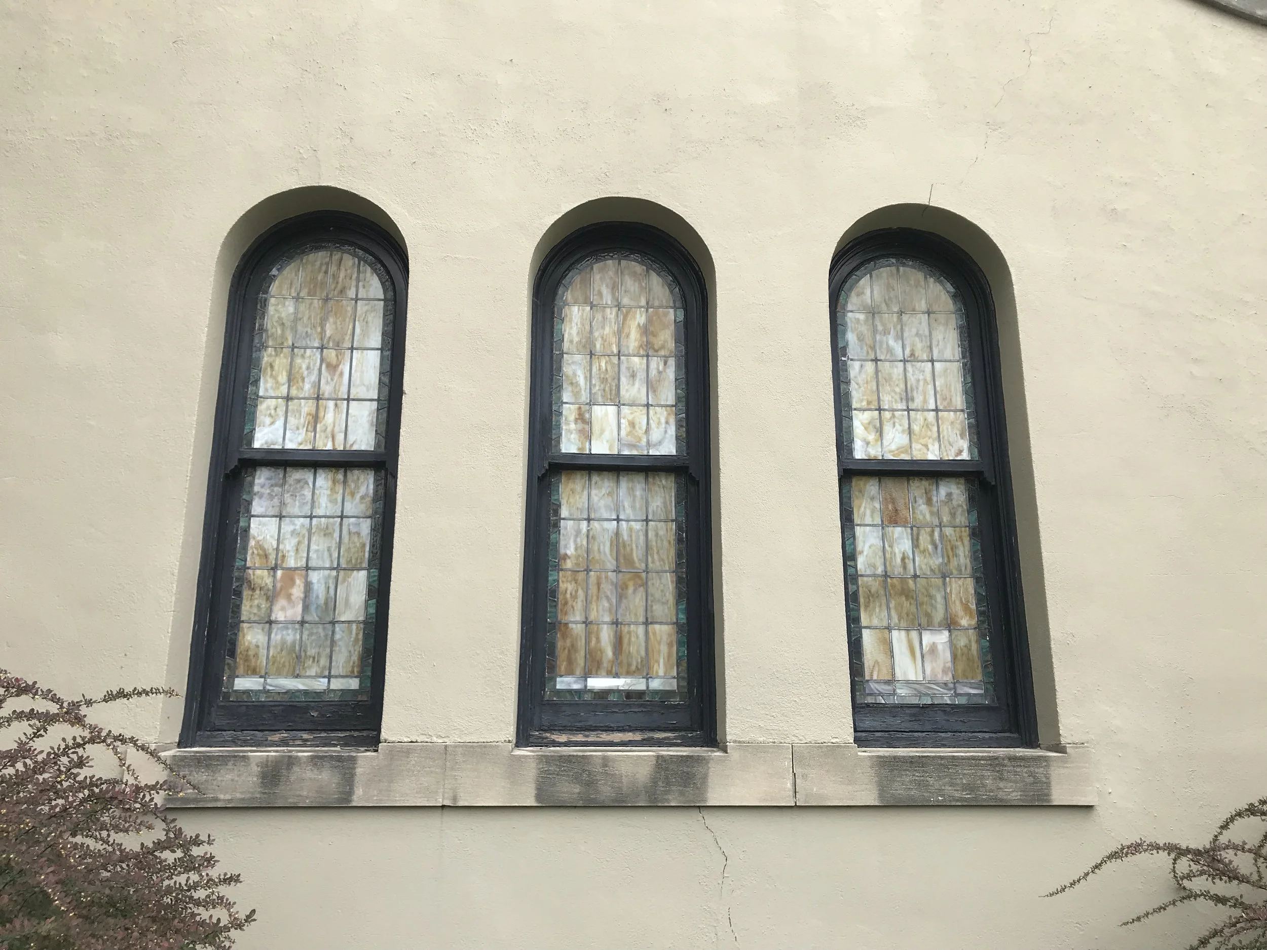 St. Francis stained glass window repair. Historical restoration by Custom Artisan Finishes in Omaha, Nebraska.