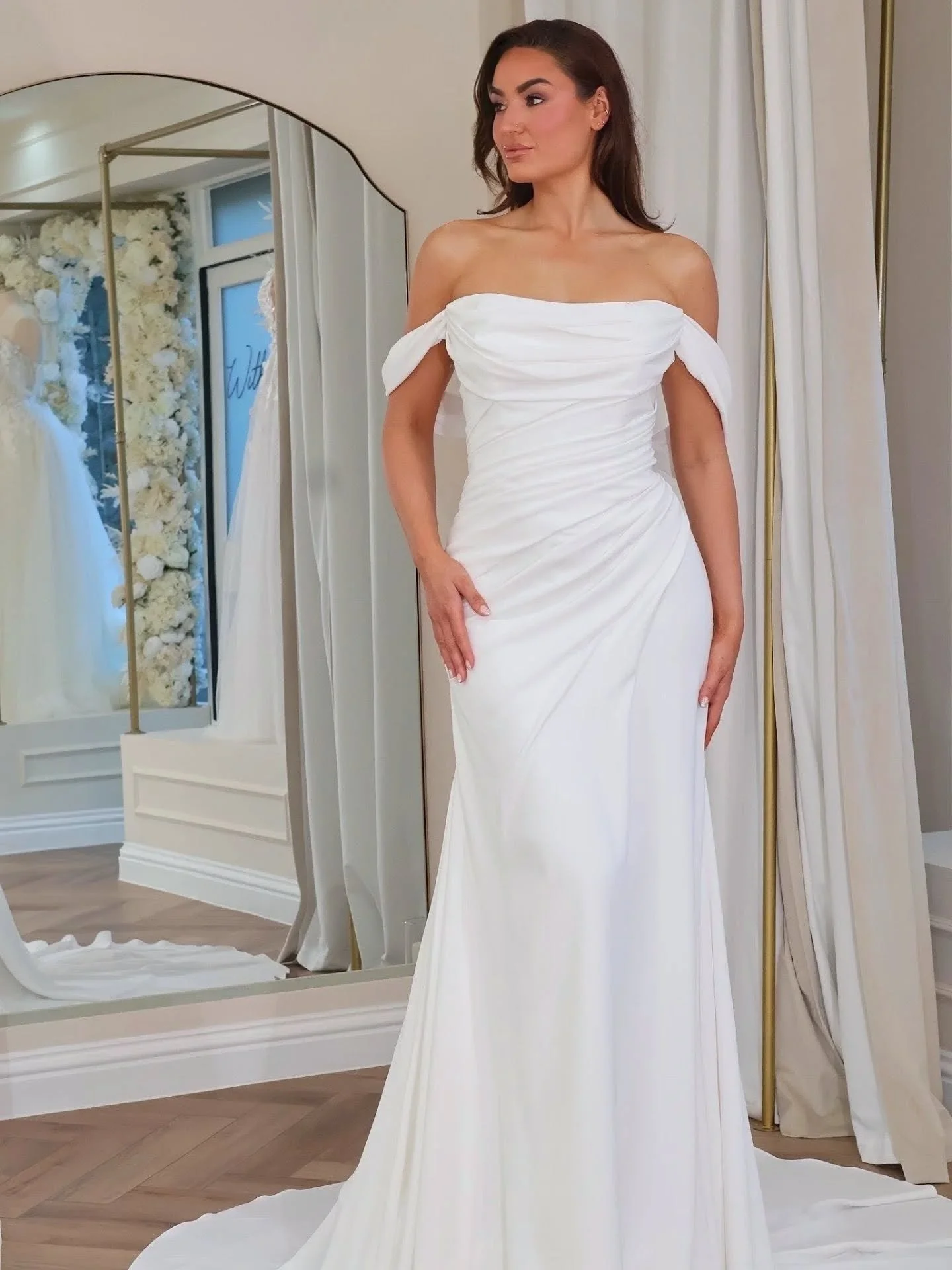 VIVIAMA by Pronovias ✨

Refined minimalist beauty at its finest.

This elegant wedding dress features a sleek mermaid silhouette and an off-the-shoulder neckline, crafted in luxurious &eacute;clat satin. With clean, sculpted lines and detachable slee