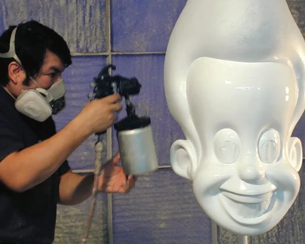 Painting Jimmy Neutron cast carbon fiber character head.