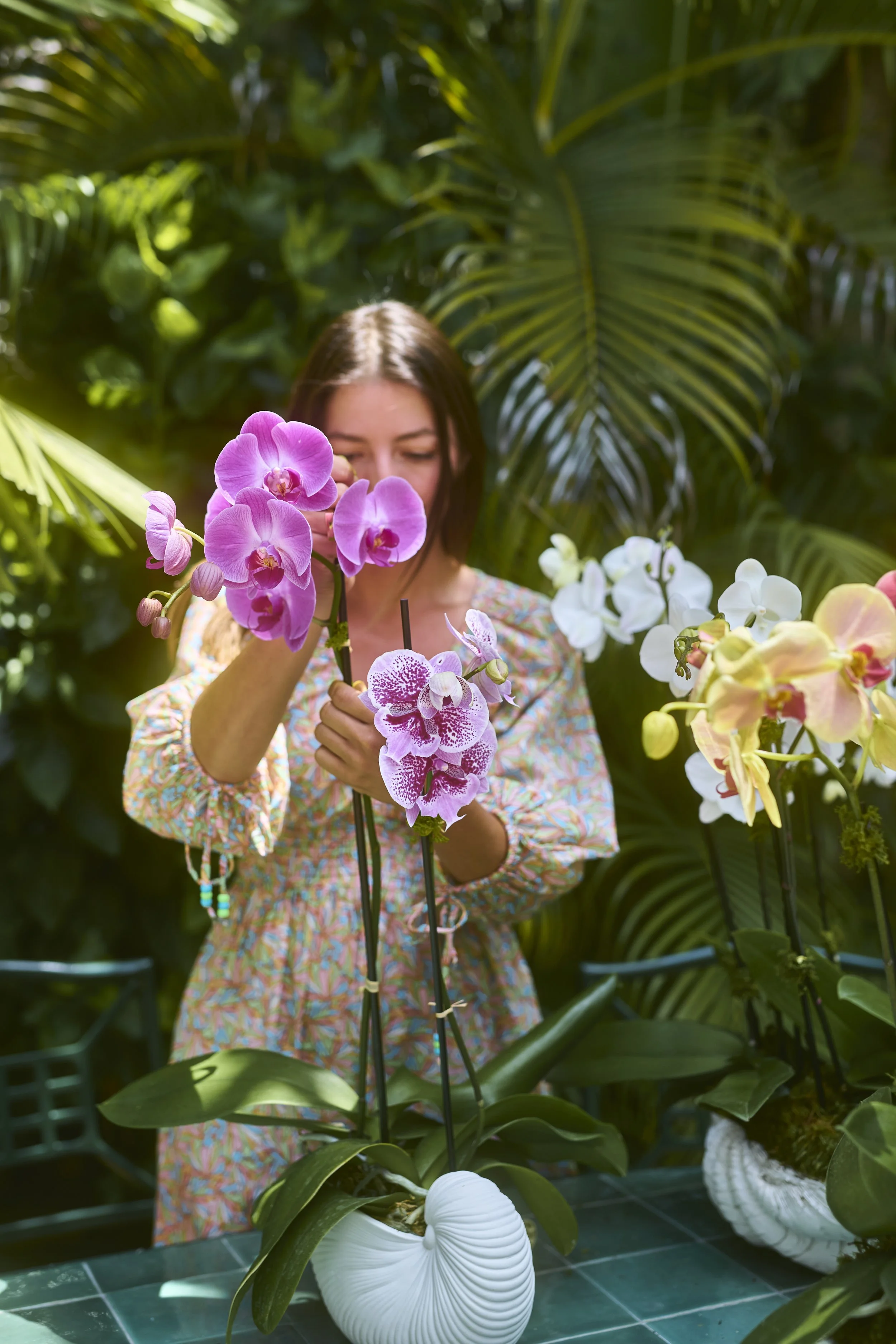 Marissa building nautilus orchid arrangement.jpg
