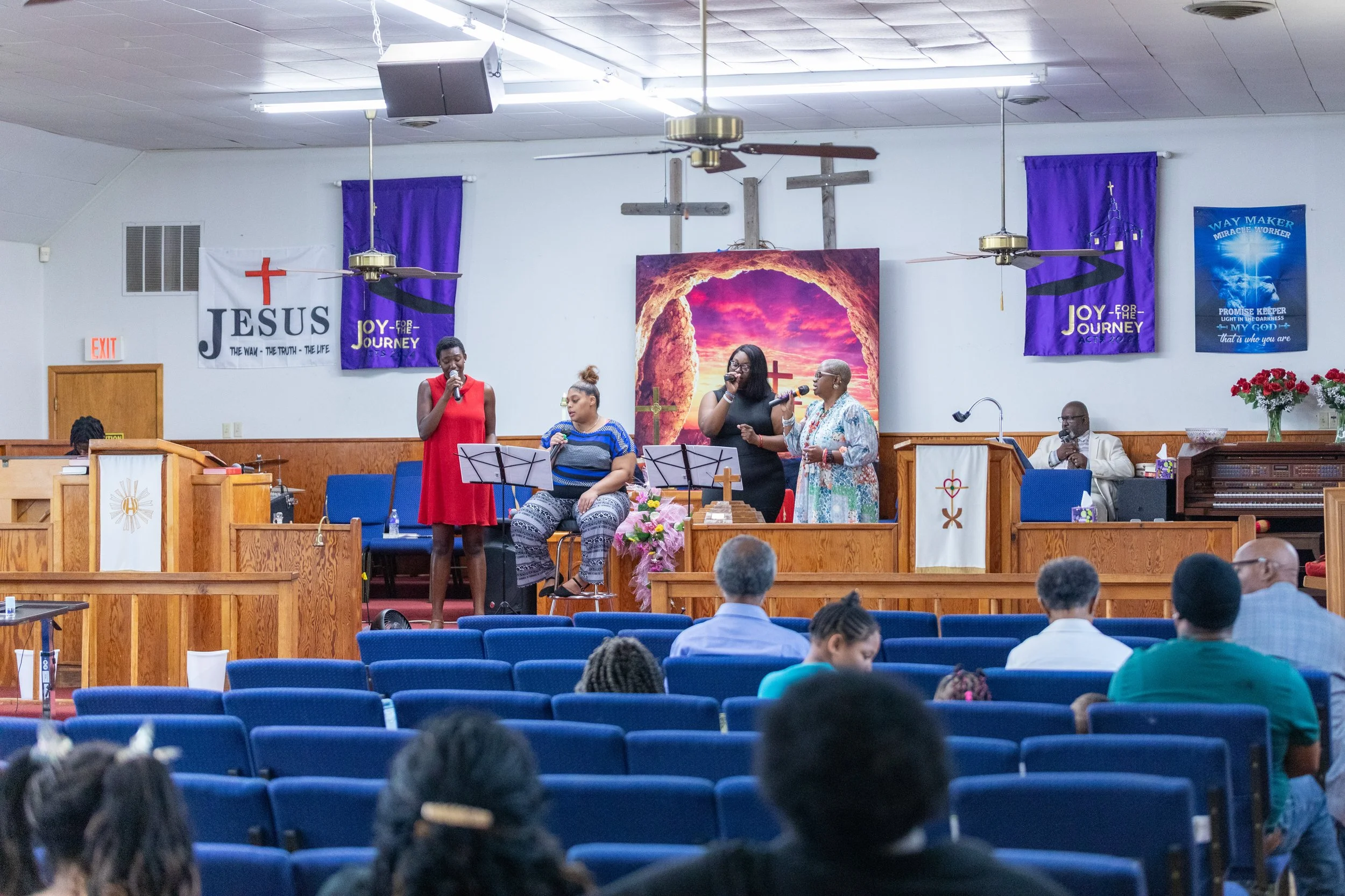 Congregation Worshiping: Members of Visionary Hollowell Community UMC engaged in Sunday worship service