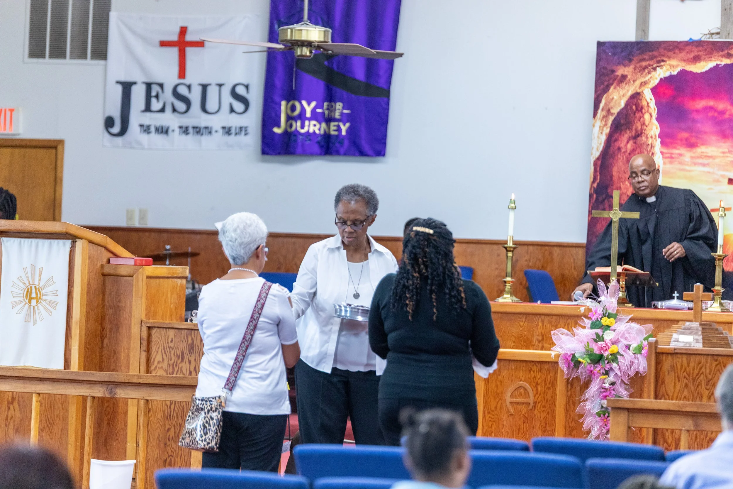 church members serving communion at Visionary Hollowell Community United Methodist Church in Midland, Texas