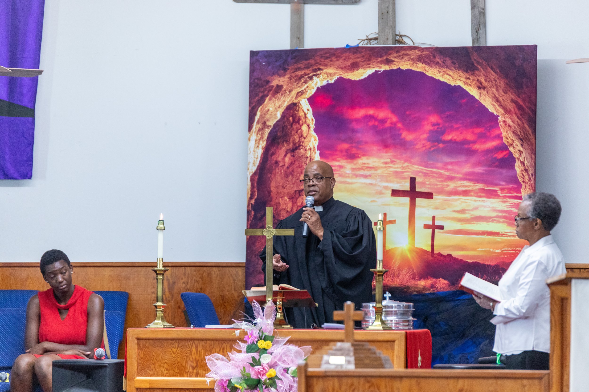 Pastor Wendell Smith preparing communion at Visionary Hollowell Community United Methodist Church in Midland, Texas