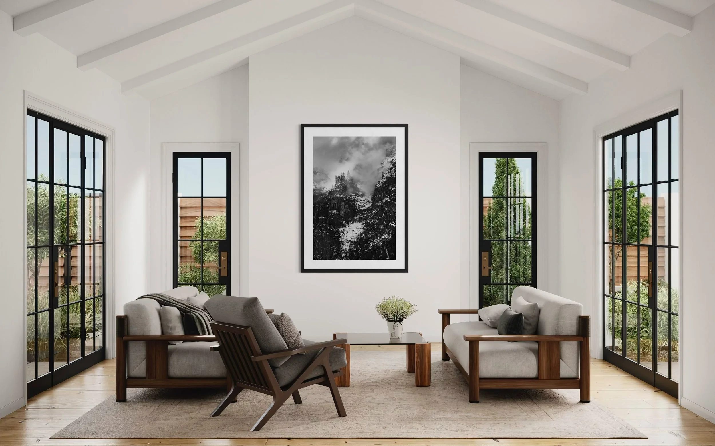 Elegant living room interior featuring framed fine art photography displayed on a neutral wall in a modern, light-filled space.