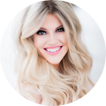 Smiling woman with long blonde hair.