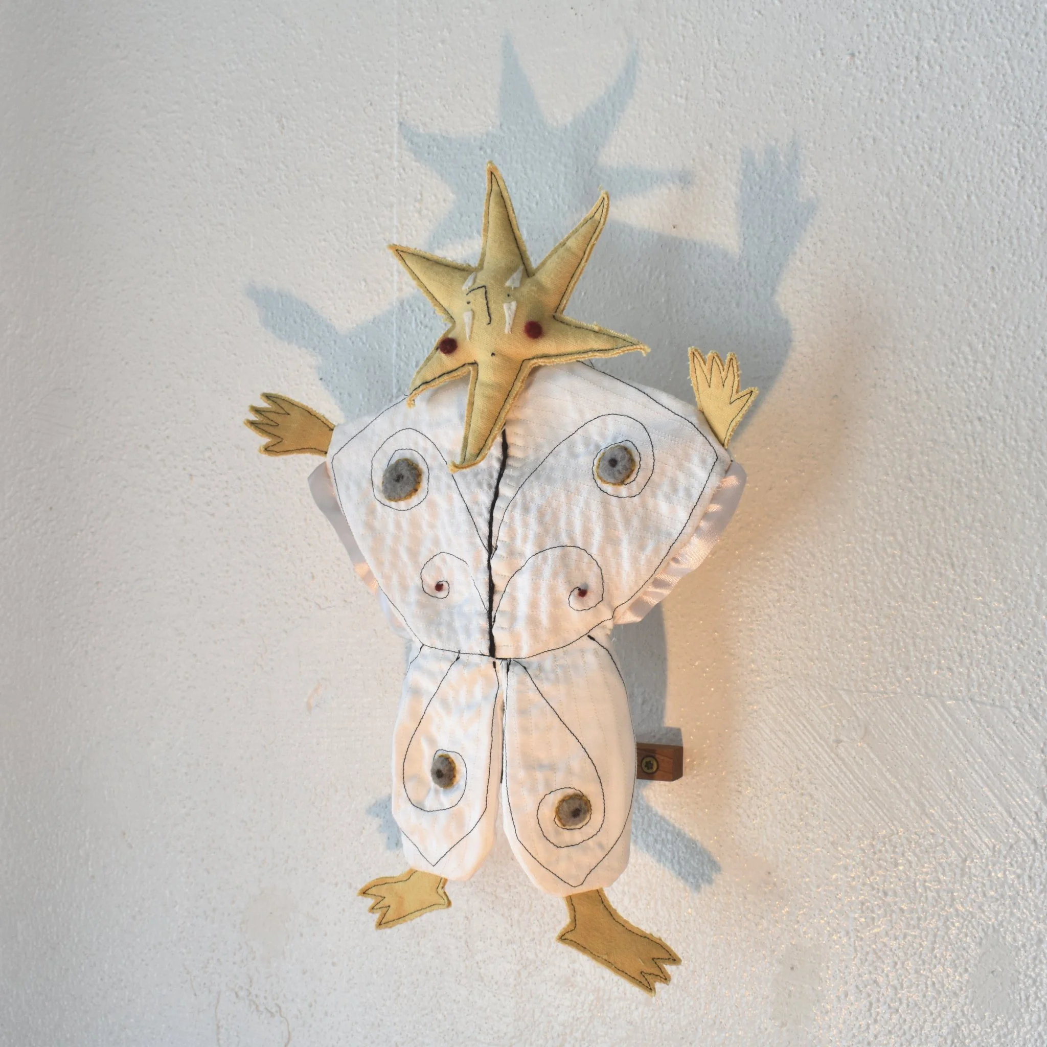 in costume, 2025 (hand puppet) | hand and machine sewn fabric, needle felted wool 