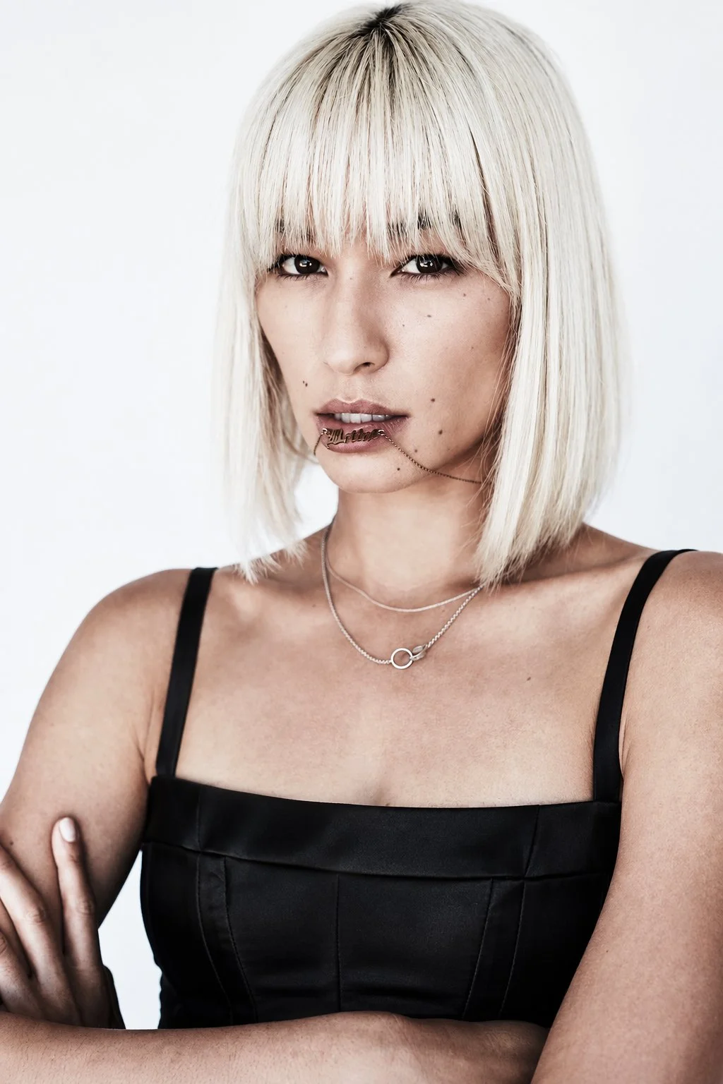 Portrait with a platinum bob and black top