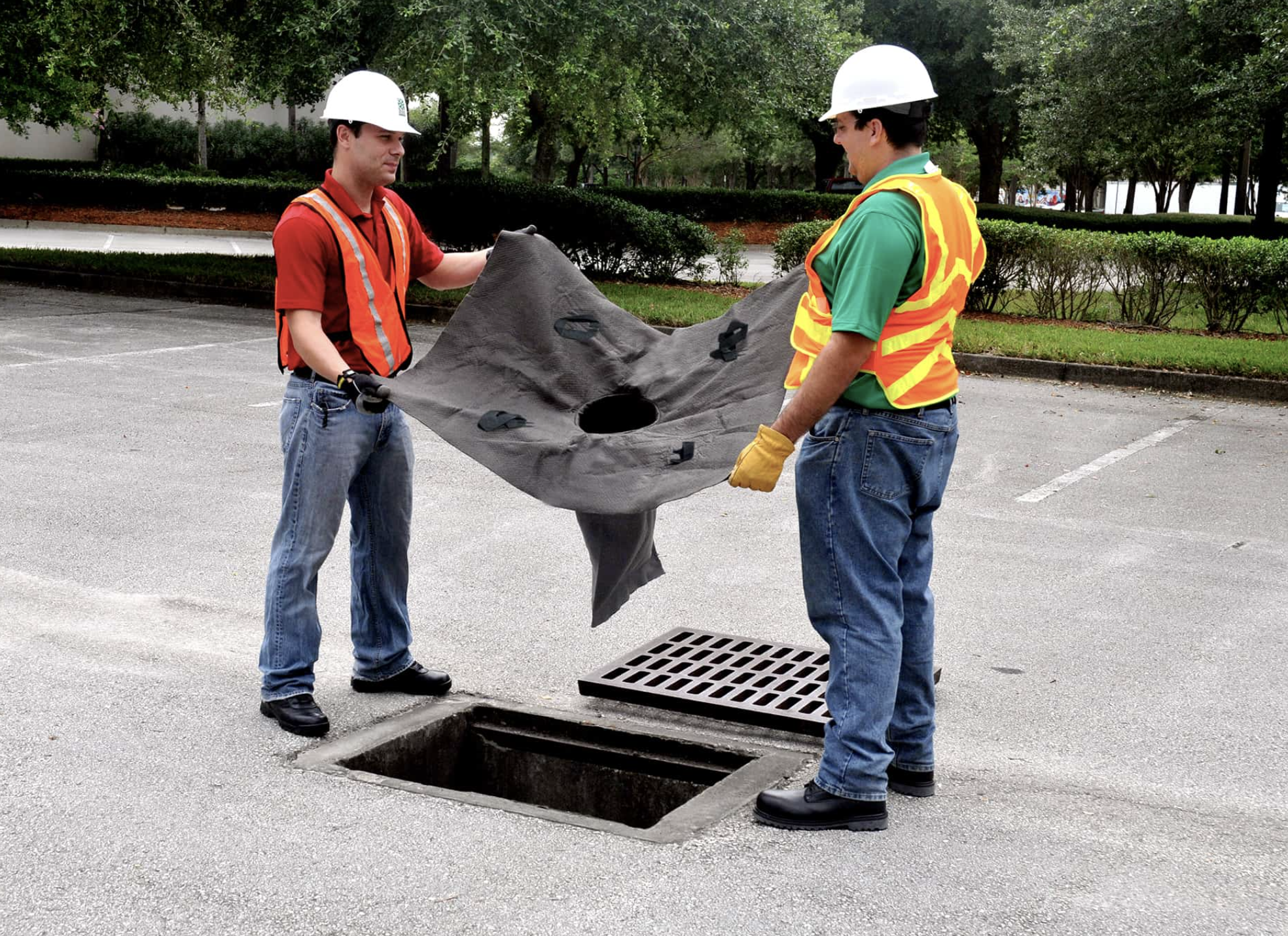drain guards being installed at a construction site.png