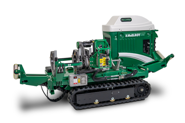 Green and white McElroy pipe fusion machine with tracked base and various mechanical components.