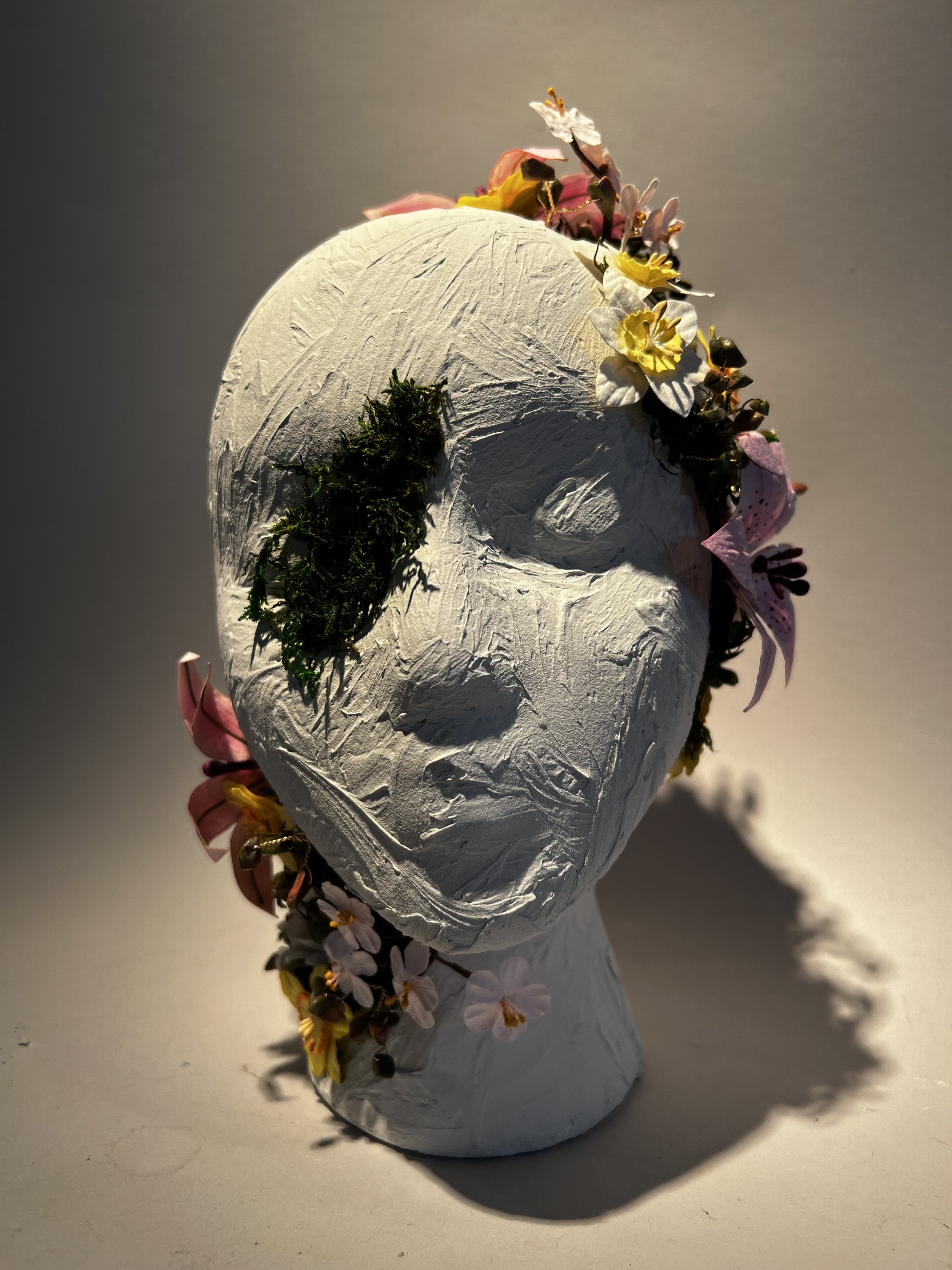 Growth Will Conquer. April 2024, Foam, Joint Compound, Moss, Paper Flowers, Wire, Unakite Beads. 5in x 12in x 6in.