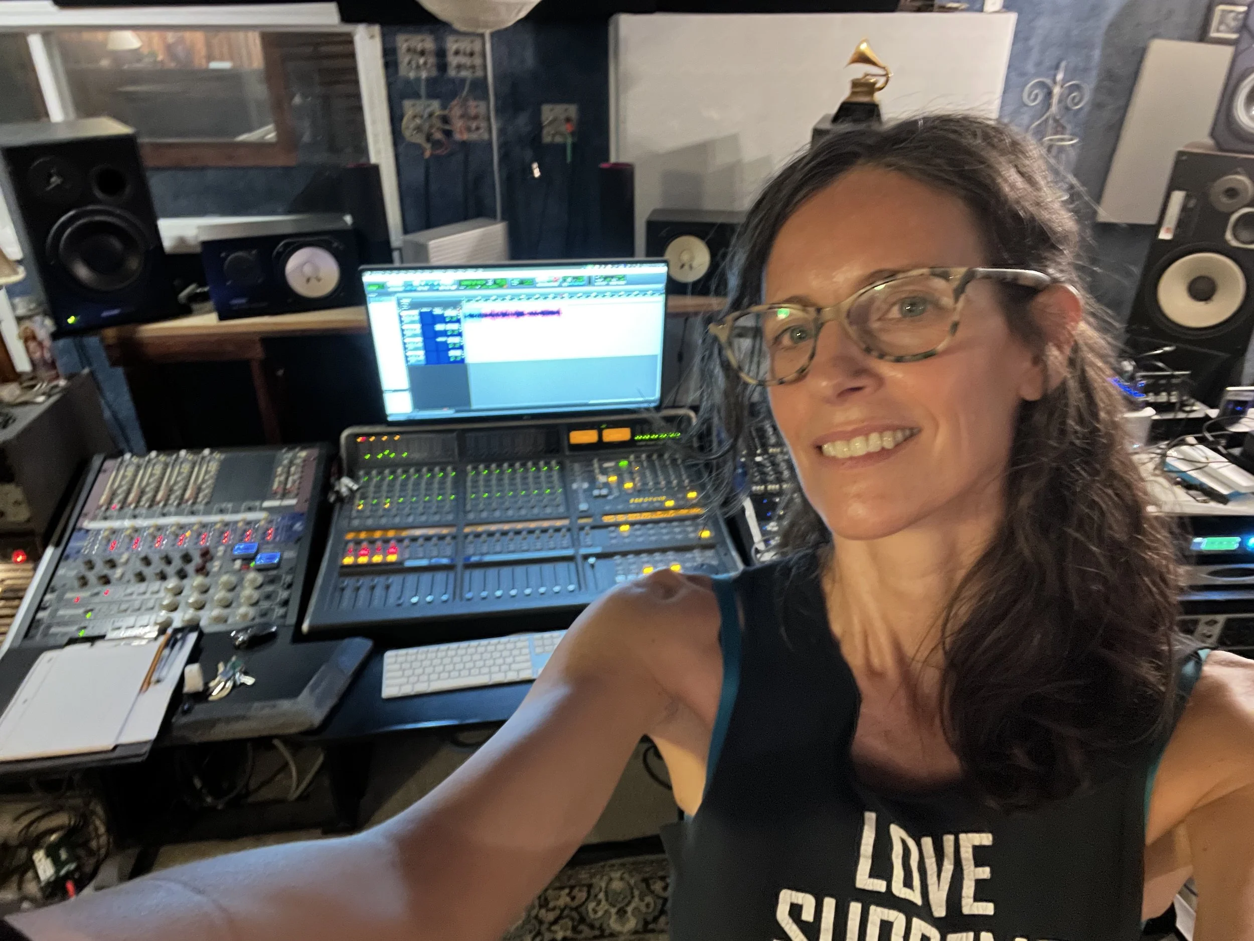 Erin Potts smiling in the studio during a recording session for Freedom Needs a Soundtrack.
