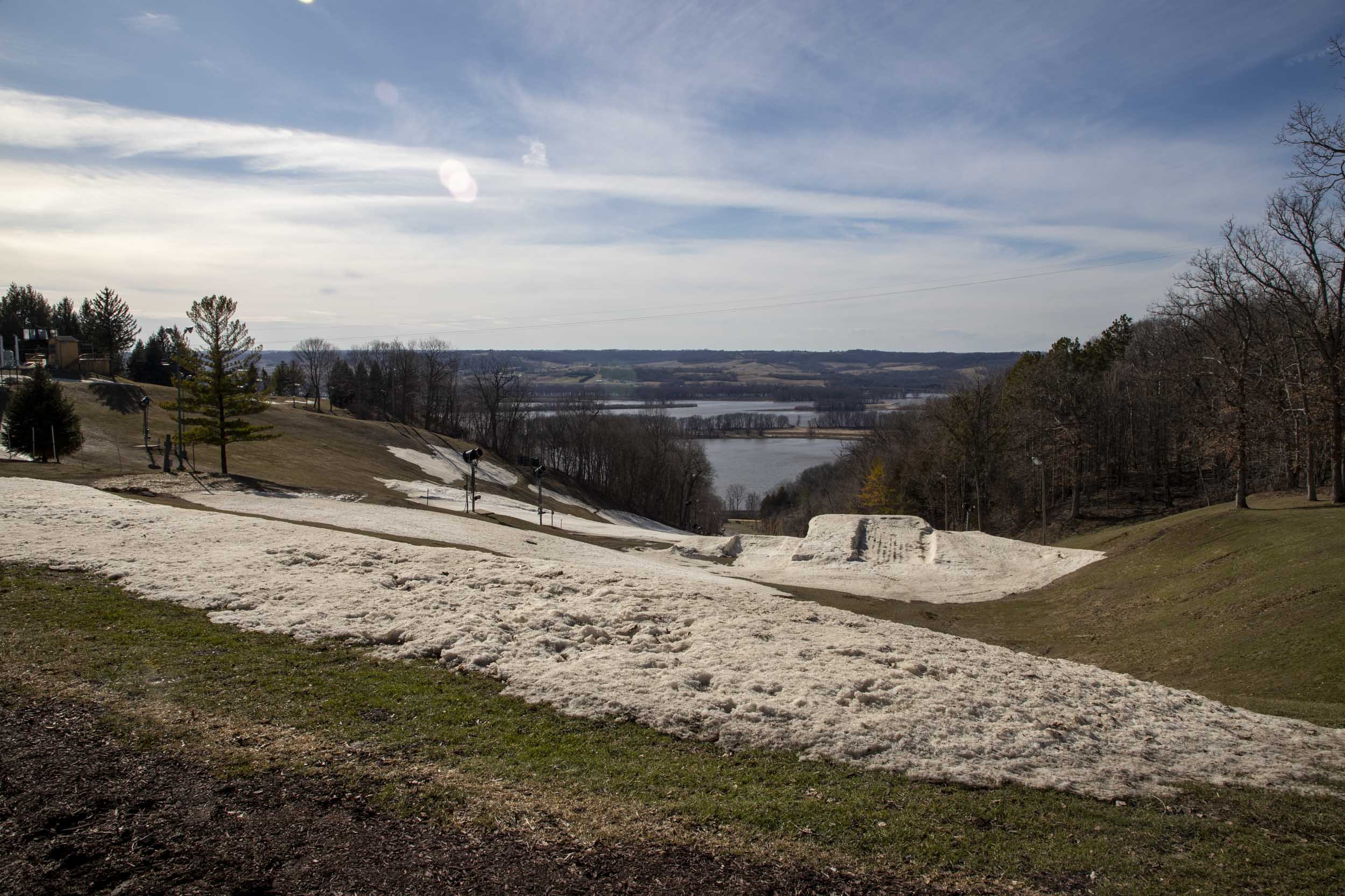 Remnants of snow from the winter season at Chestnuts Recreation Center with the Mississippi River in the background.