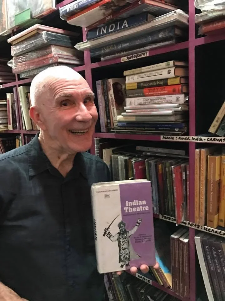 Dr. Farley Richmond finding his book on the shelf in New Delhi, India