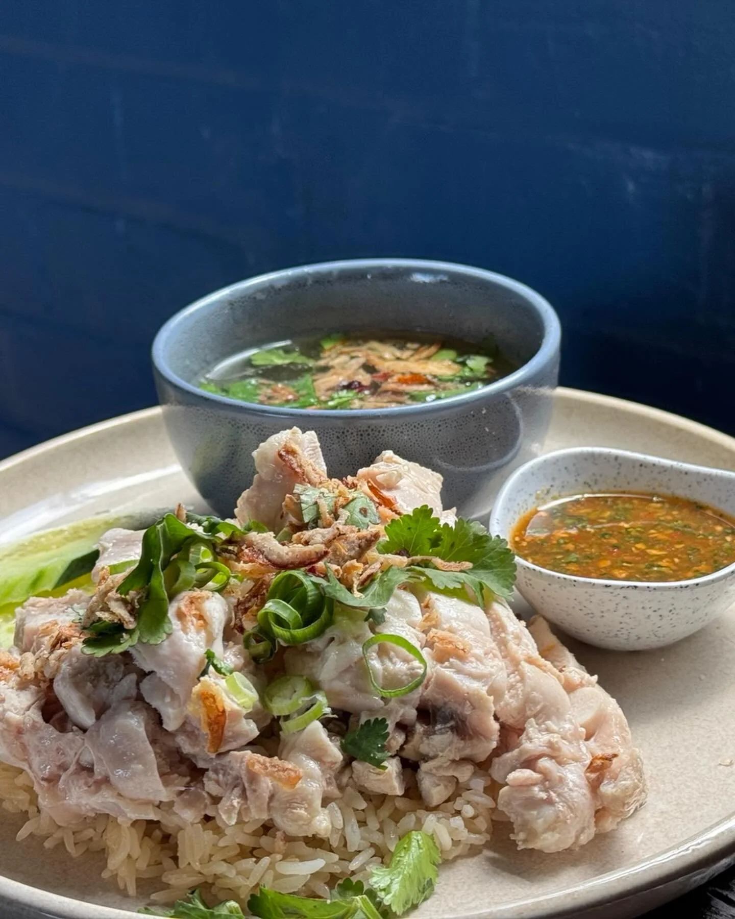 Monday lunch, sorted.

ข้าวมันไก่ (Khao Man Gai) &mdash; tender poached chicken, fragrant ginger rice, rich broth, and our house chilli sauce that keeps locals coming back.

Available from 12:00pm until sold out. No shortcuts, just proper Thai street