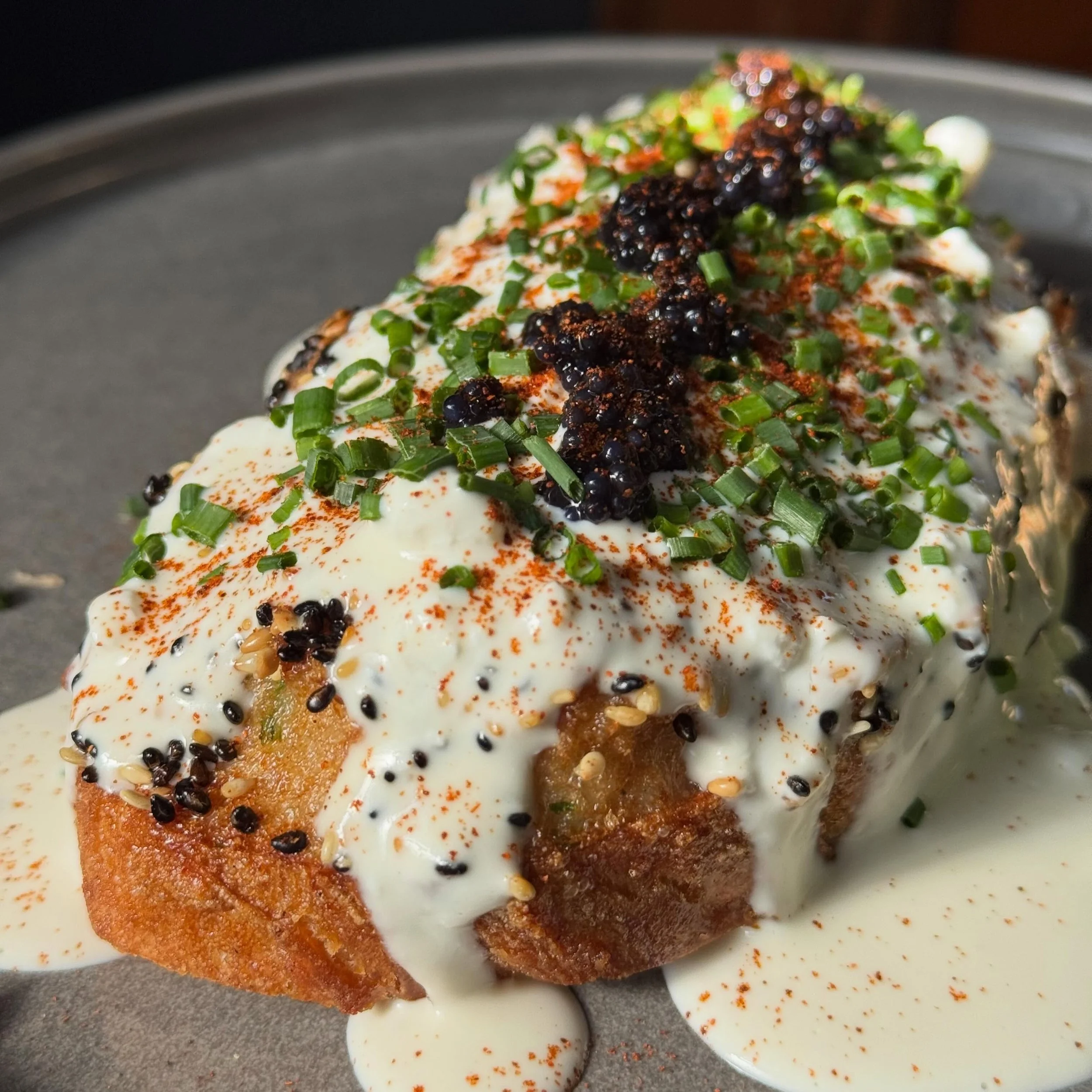 Saturday&rsquo;s special done right.
Our Sesame-Crusted Prawn Toast Royale features crispy sesame-crusted prawn toast, silky whipped eggs, umami roe, fresh herbs, and a drizzle of our house-made spicy mayo&mdash;finished with a light slaw for balance