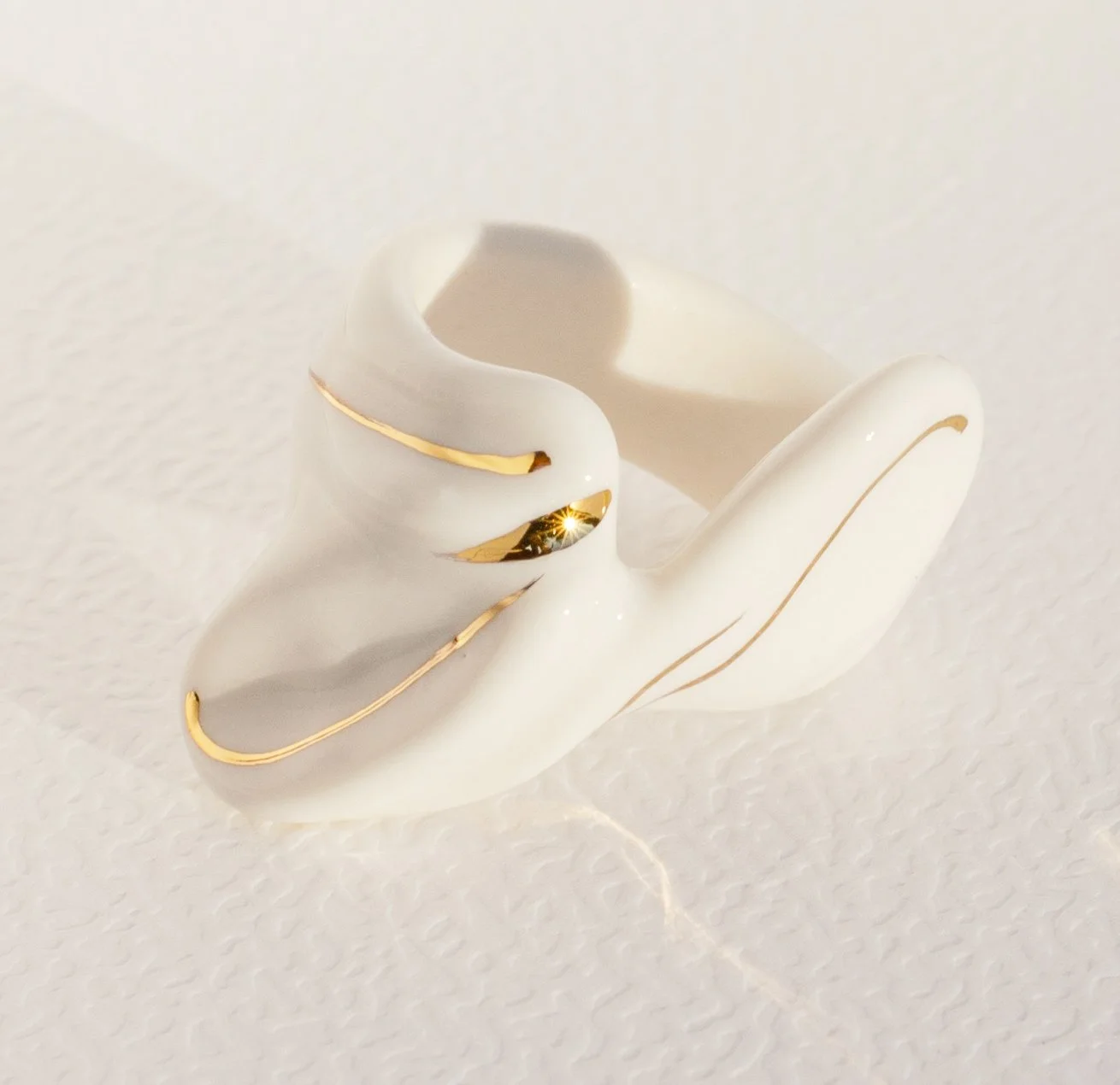 Handmade porcelain ring with 24k gold details.