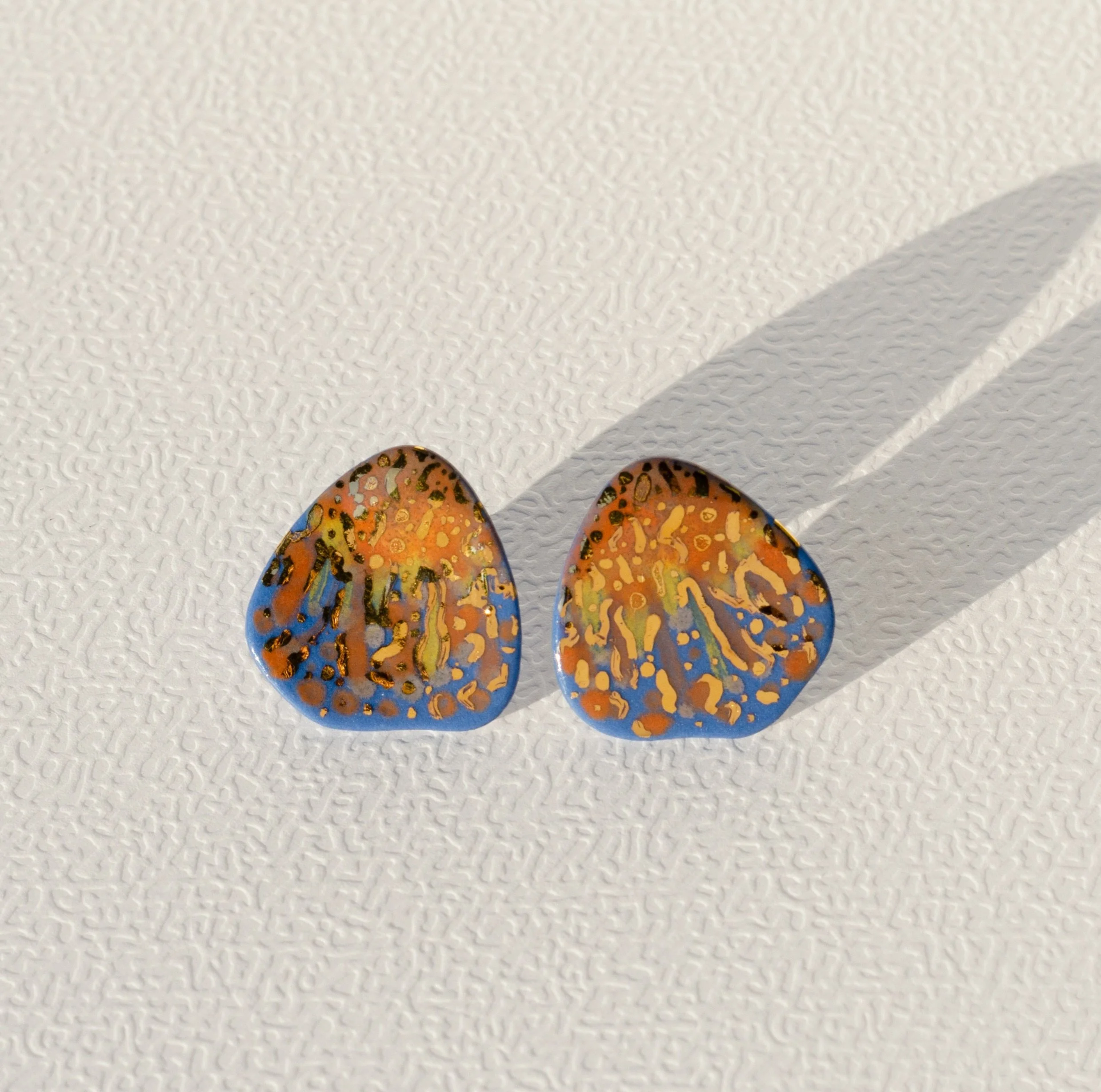 Anyone else planning their day around sunsets?

Team Sunset earrings 
Available on raiars.com

Entirely hand-carved in blue porcelain &middot; 24k gold accents &middot; Sterling silver posts