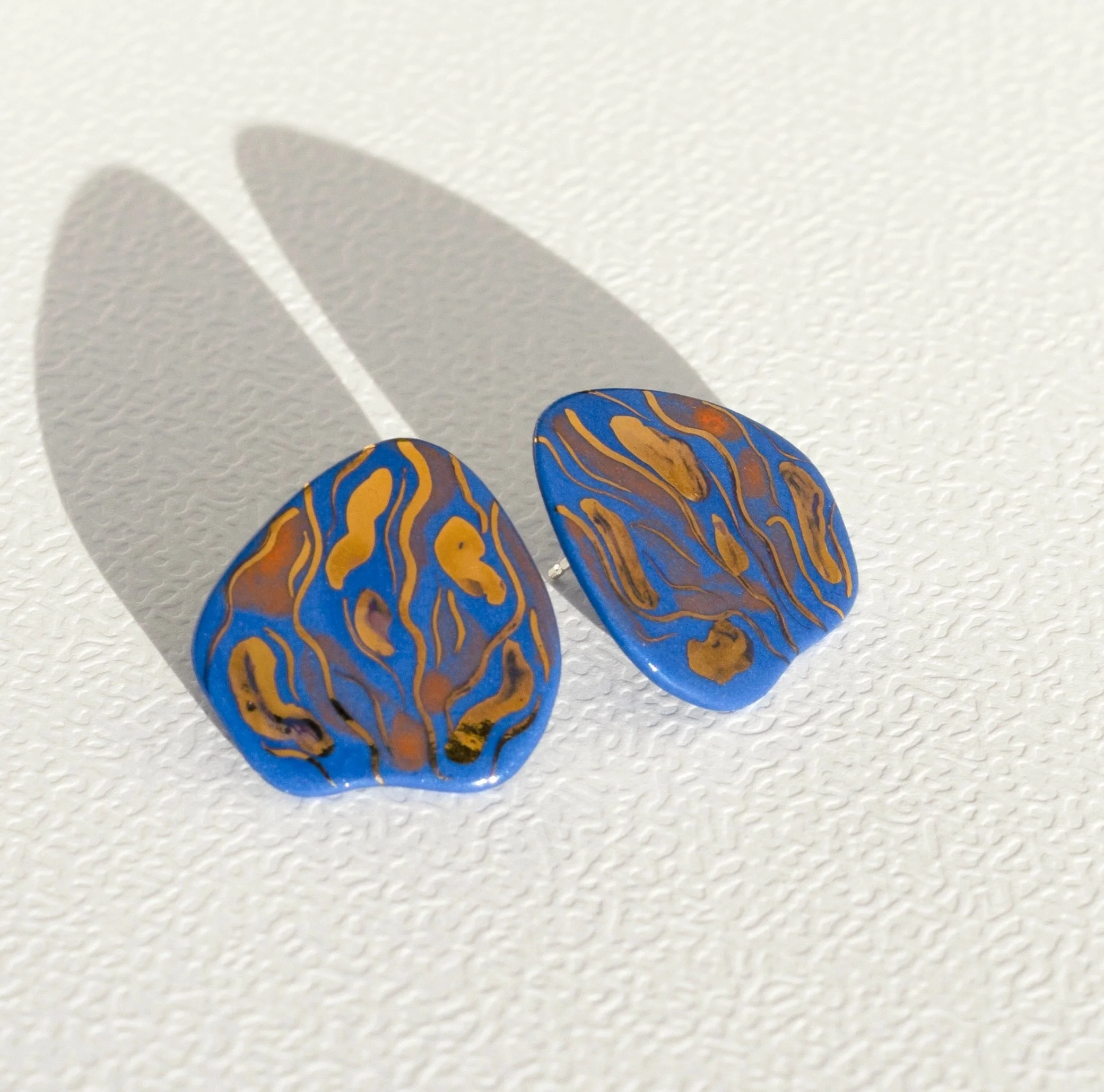 The longer I look, the more there is to find. 

Staying Curious earrings
Available on raiars.com

Entirely hand-carved in blue porcelain &middot; 24k gold accents &middot; Sterling silver posts