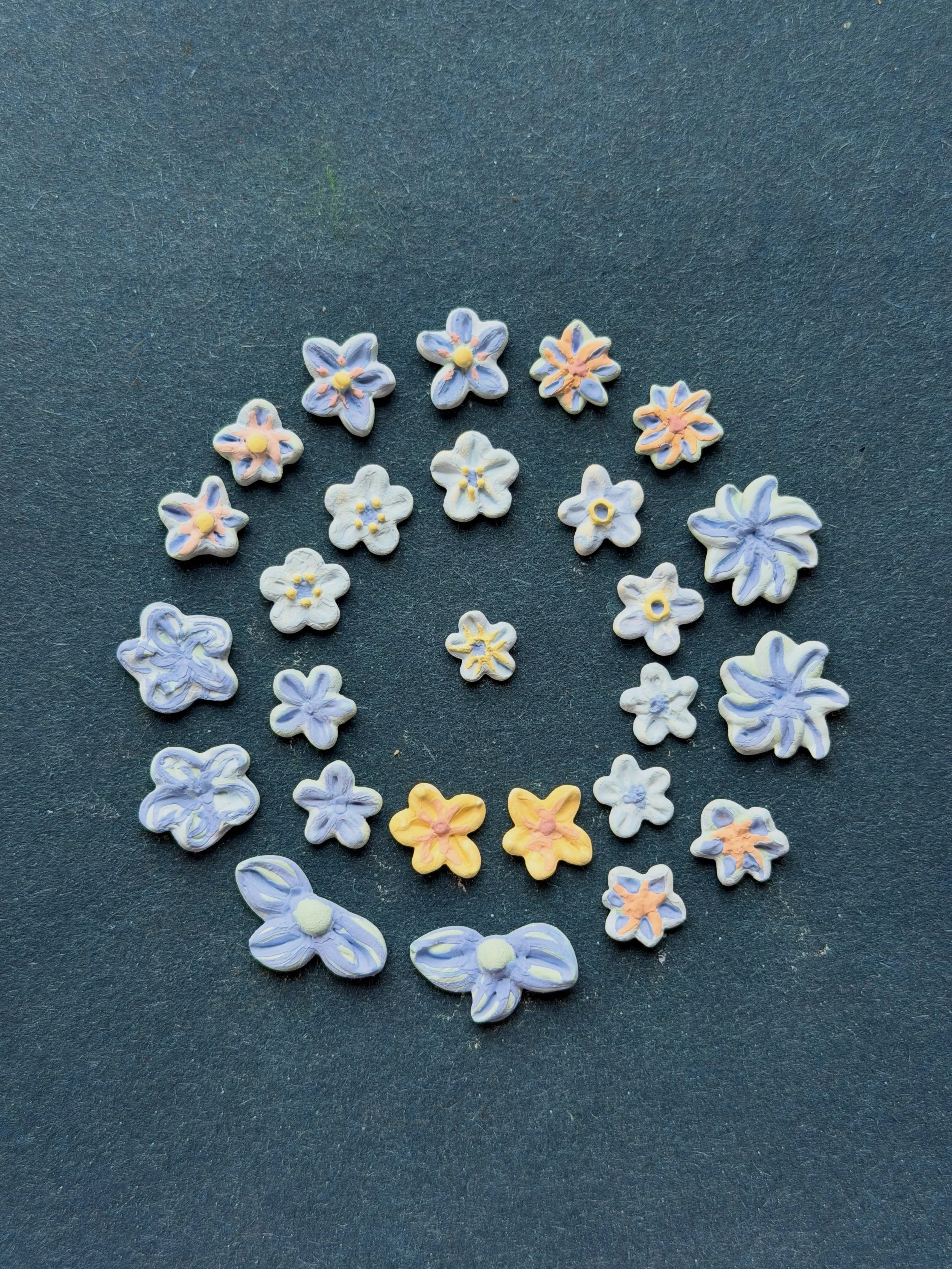 I&rsquo;m working on smaller, more colorful earrings these days. I feel like diving into color, experimenting a bit more and trying some new techniques. Working on a smaller scale is a little more challenging too.

So today I painted these little one