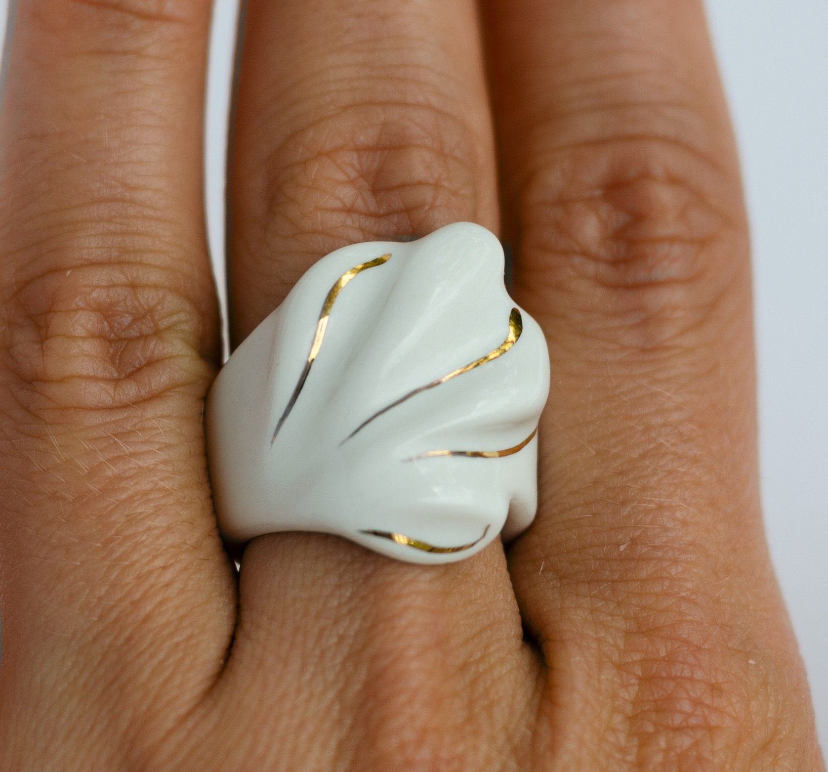 I see waves. I see petals. Sometimes leaves.
What do you see?

Calm After ring 

Available on raiars.com
Entirely hand-carved in porcelain &middot; 24k gold accents