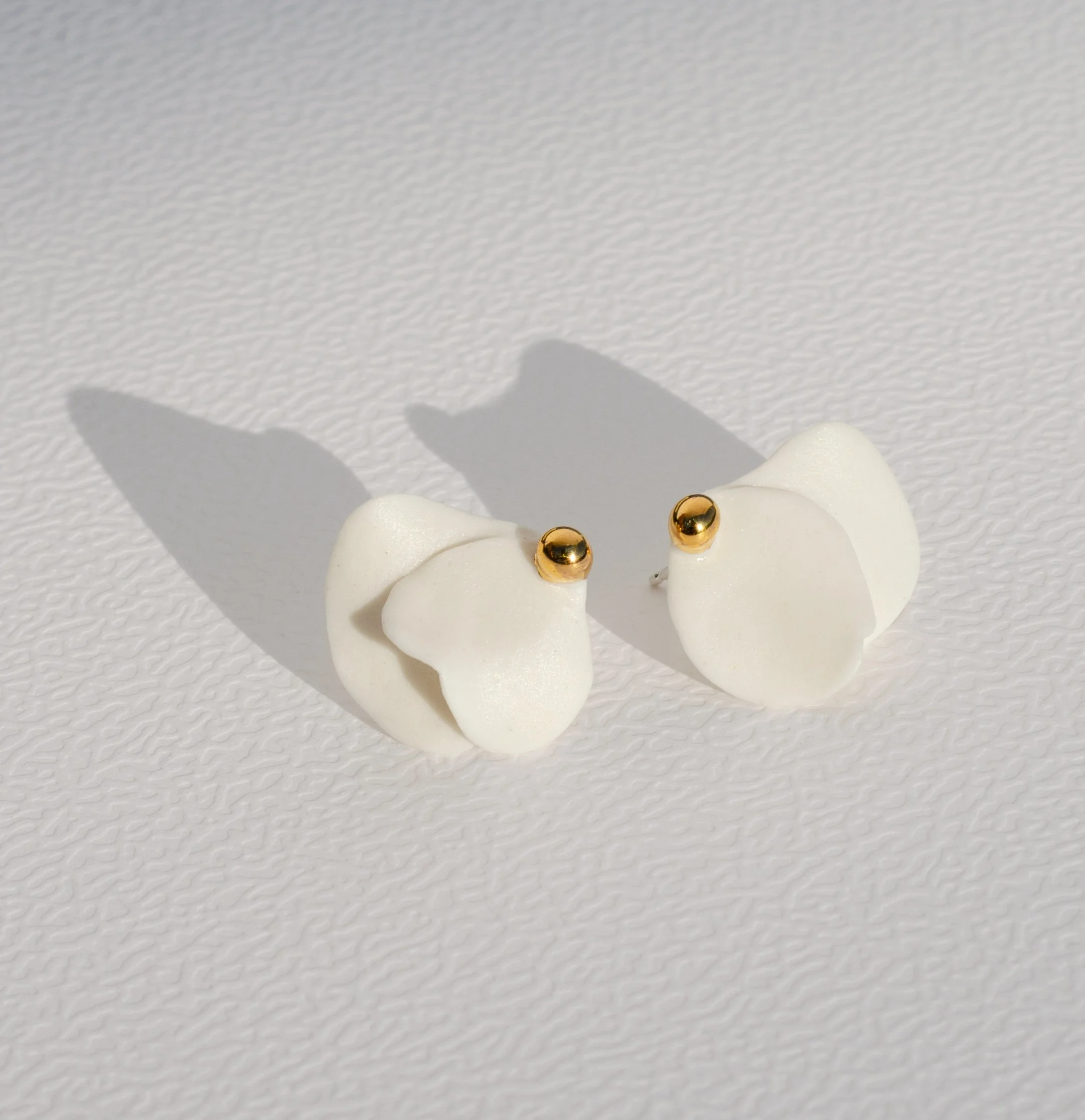 Handmade porcelain earrings with 24k gold details, fitted with 925 sterling silver posts and butterfly backs.