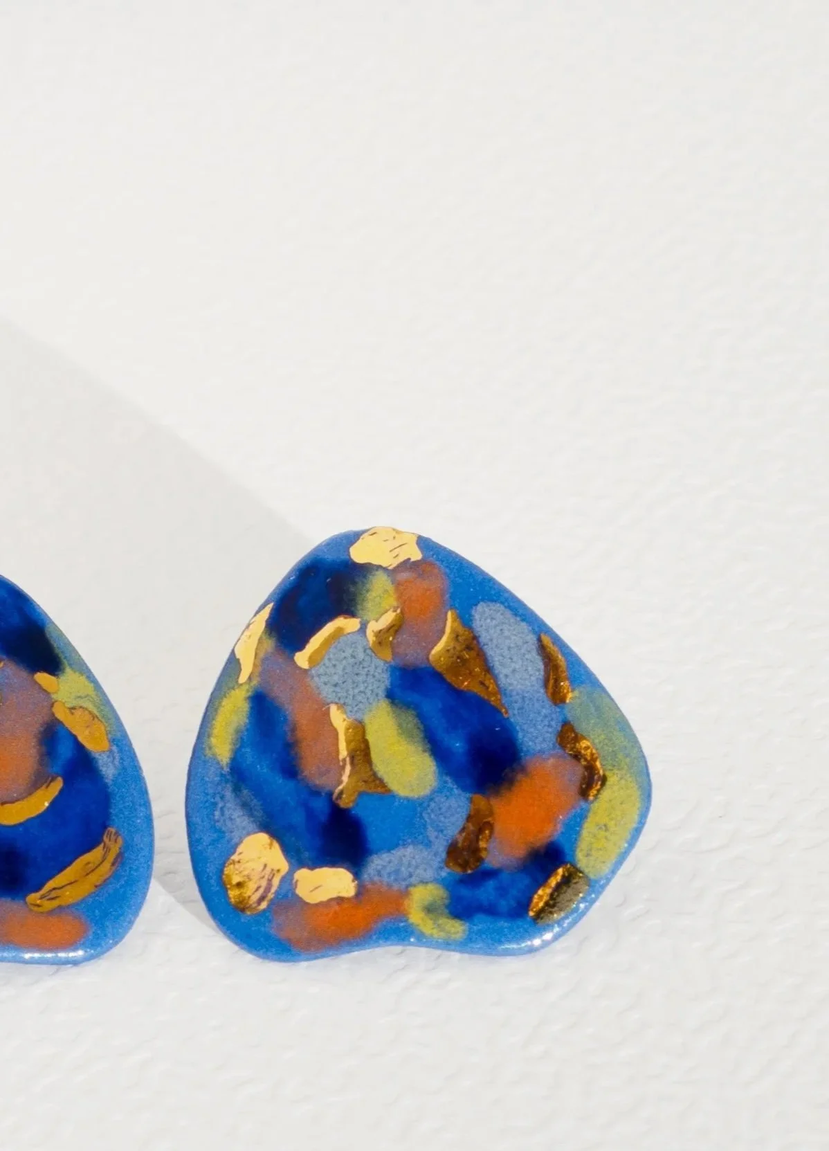 Handmade porcelain earrings with 24k gold details, fitted with 925 sterling silver posts and butterfly backs.