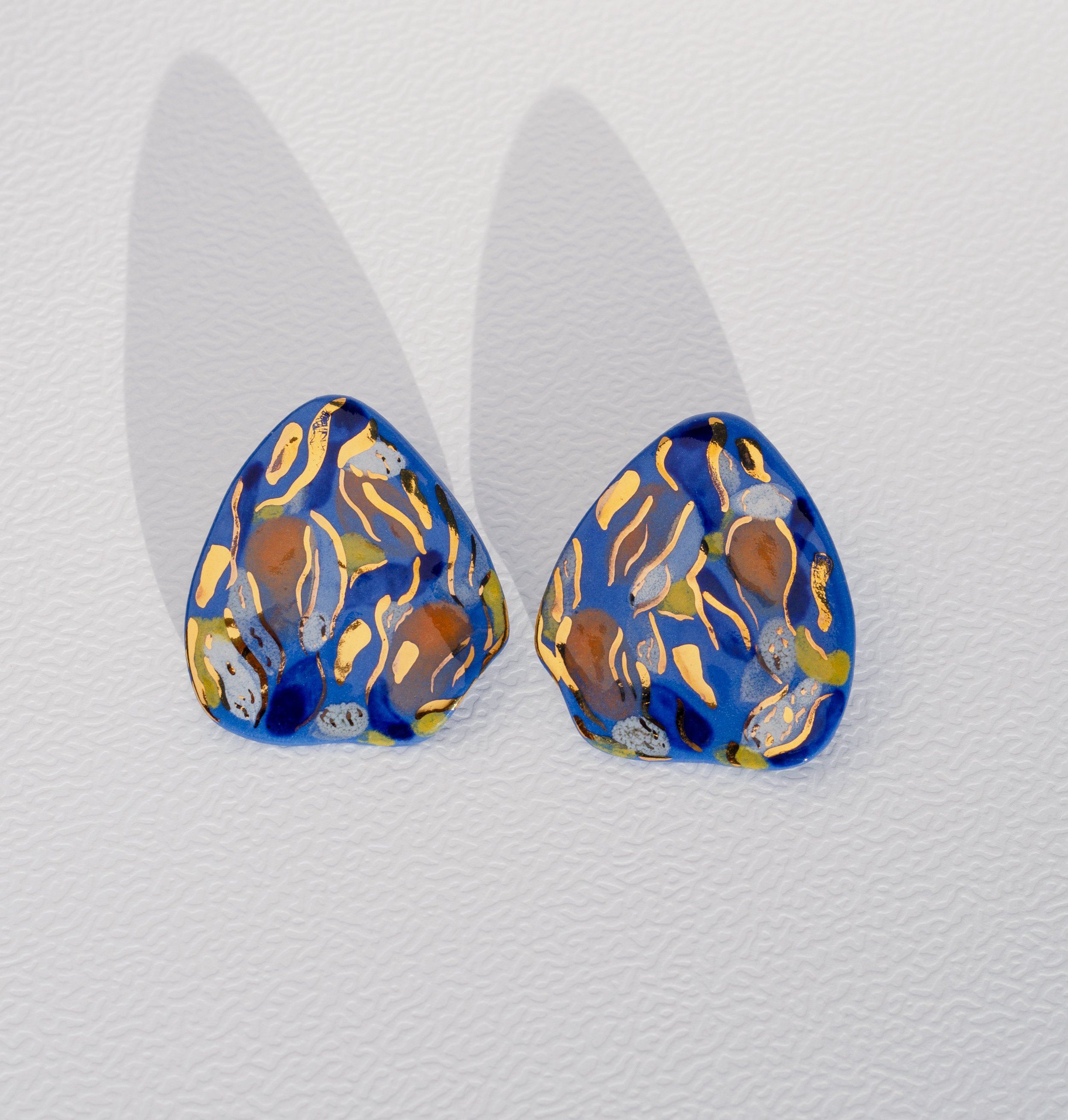 Handmade porcelain earrings with 24k gold details, fitted with 925 sterling silver posts and butterfly backs.