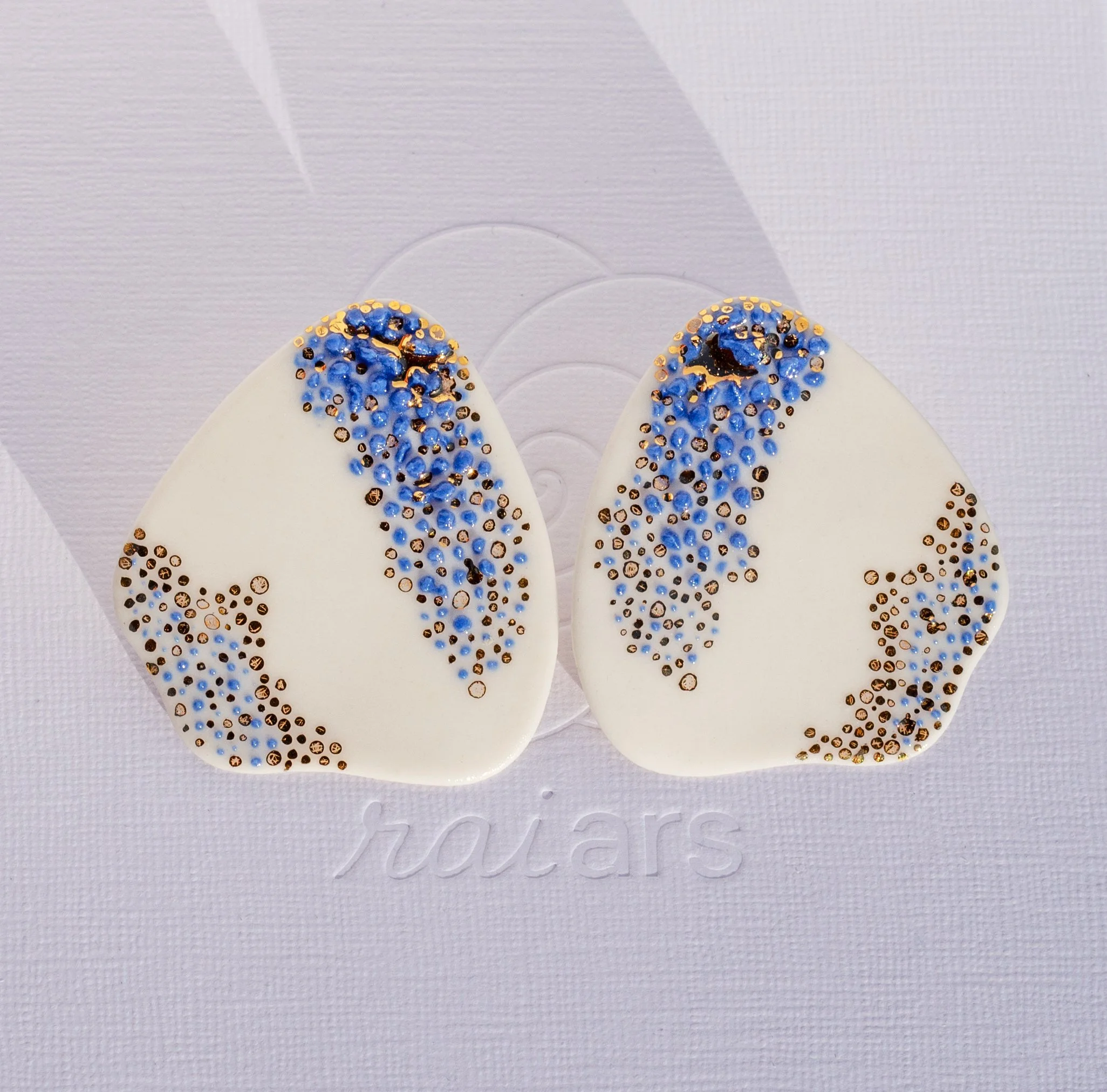 Handmade porcelain earrings with 24k gold details, fitted with 925 sterling silver posts and butterfly backs.
