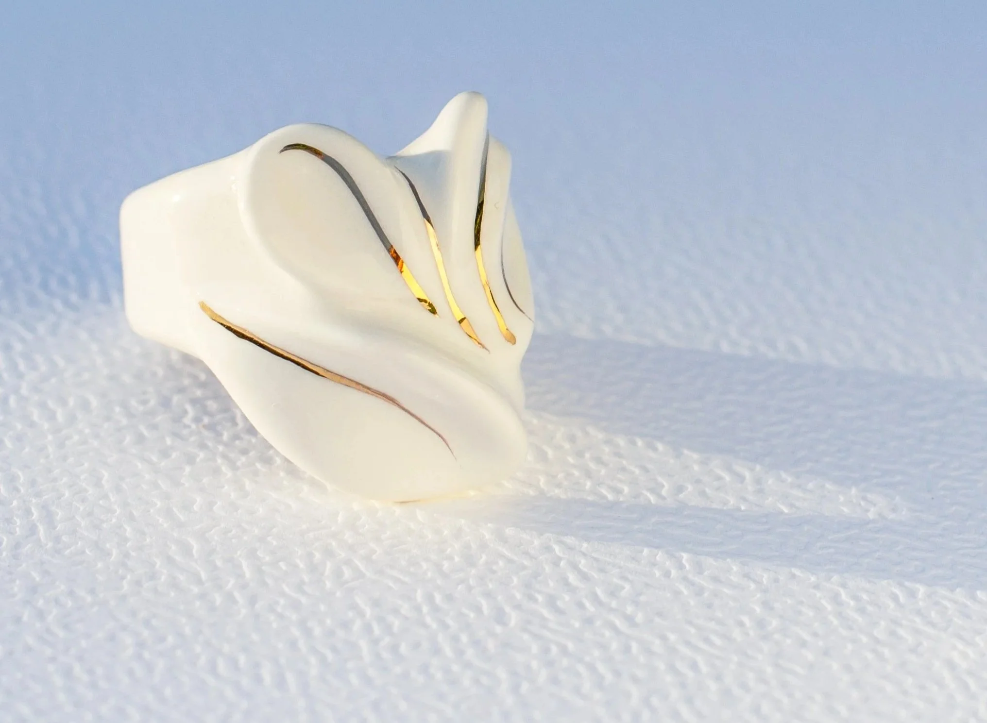 Handmade porcelain ring with 24k gold details.