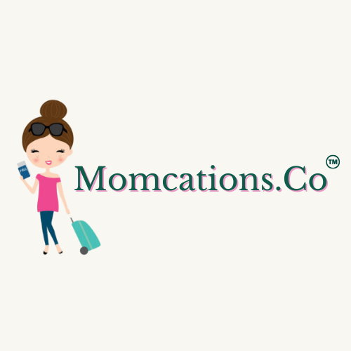 Cartoon woman with sunglasses, carrying a suitcase and holding a phone, next to the text "Momcations.Co".