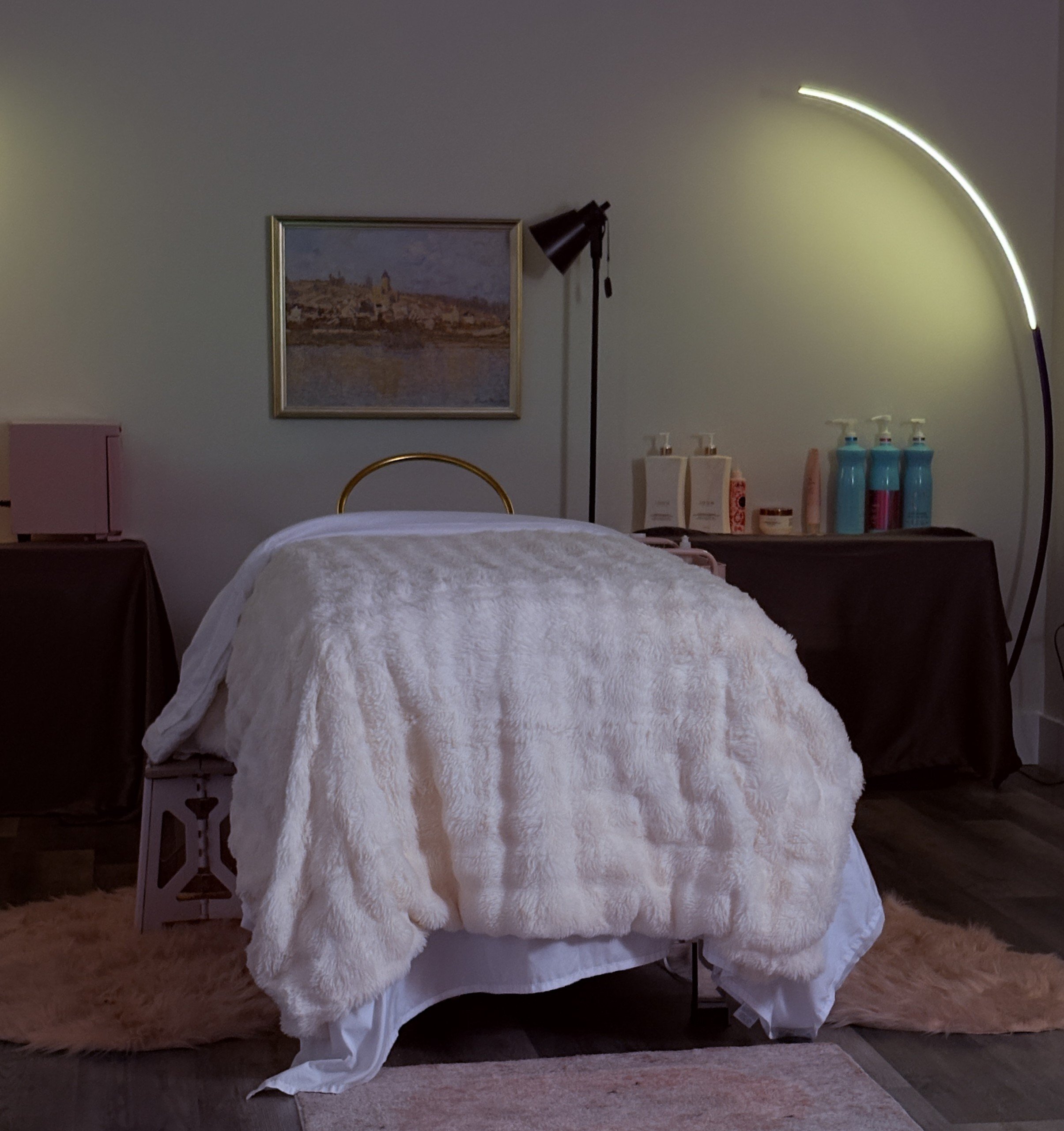 Head Spa treatment table dressed with fresh linens, ready to help you unwind.