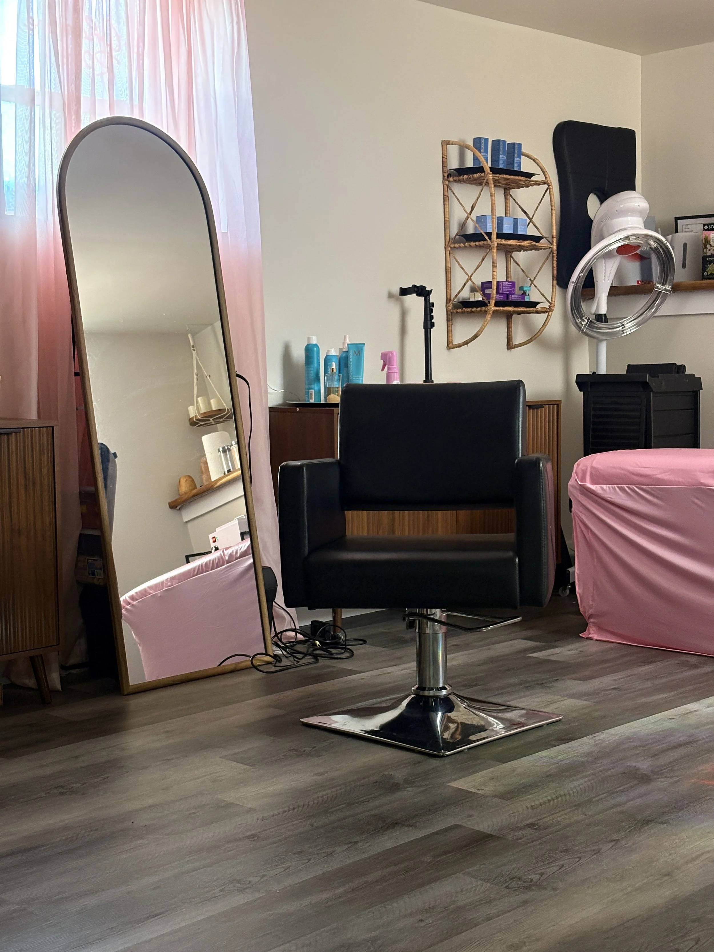 Salon chair is turned towards client, welcoming women in Spokane Valley