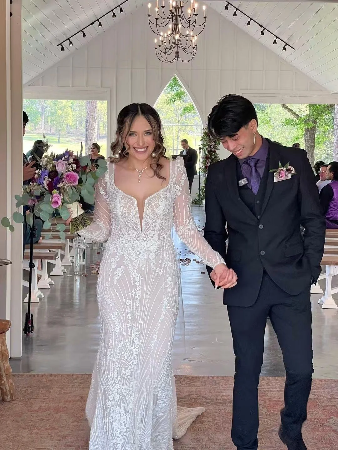A bride and groom walking hand in hand walking into their future as Husband and Wife