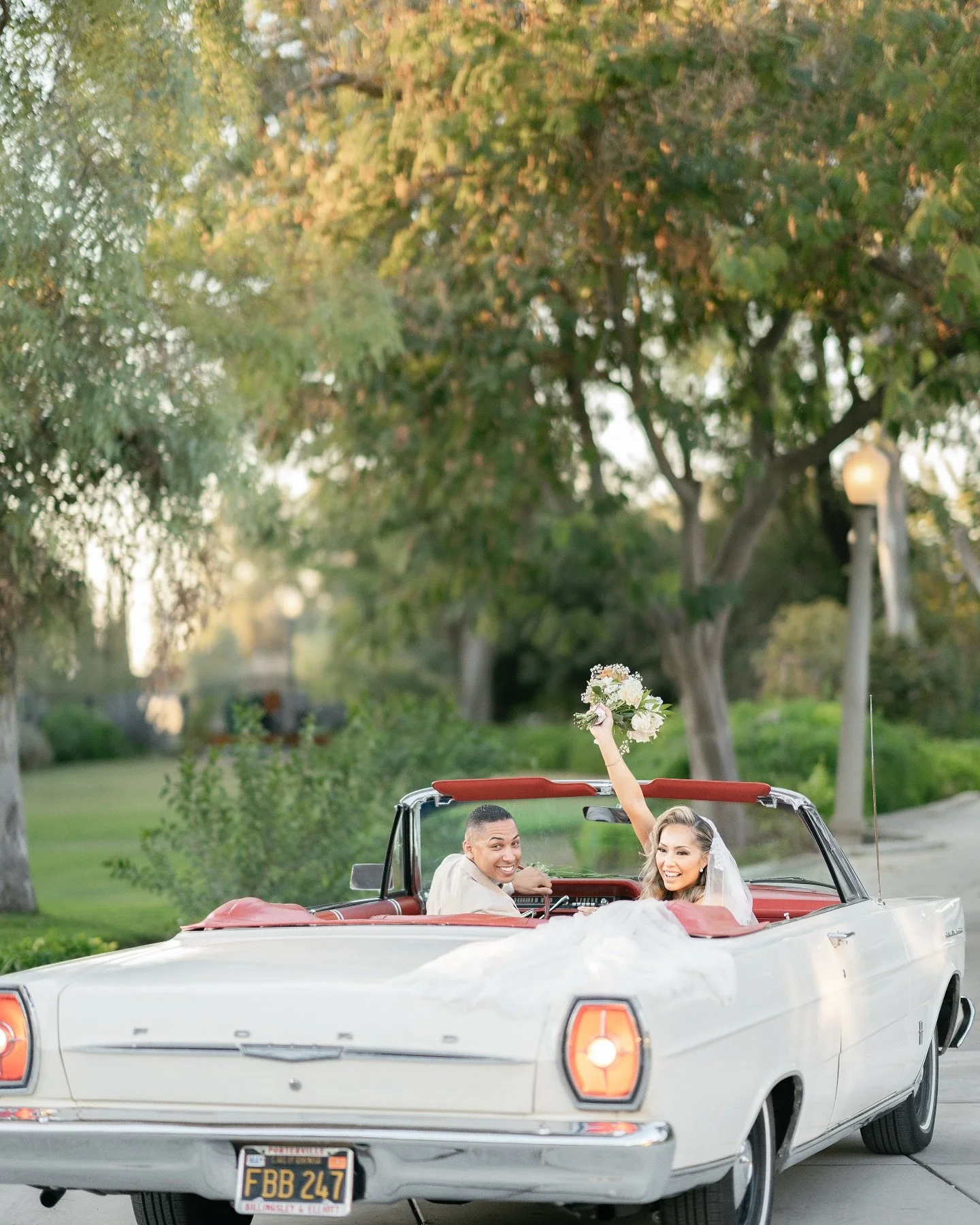 Capturing moments of pure joy is why I fell in love with wedding photography in the first place! This classic getaway shot from last year still makes me smile.

The newlyweds chose a stunning vintage Ford convertible with its iconic white exterior an